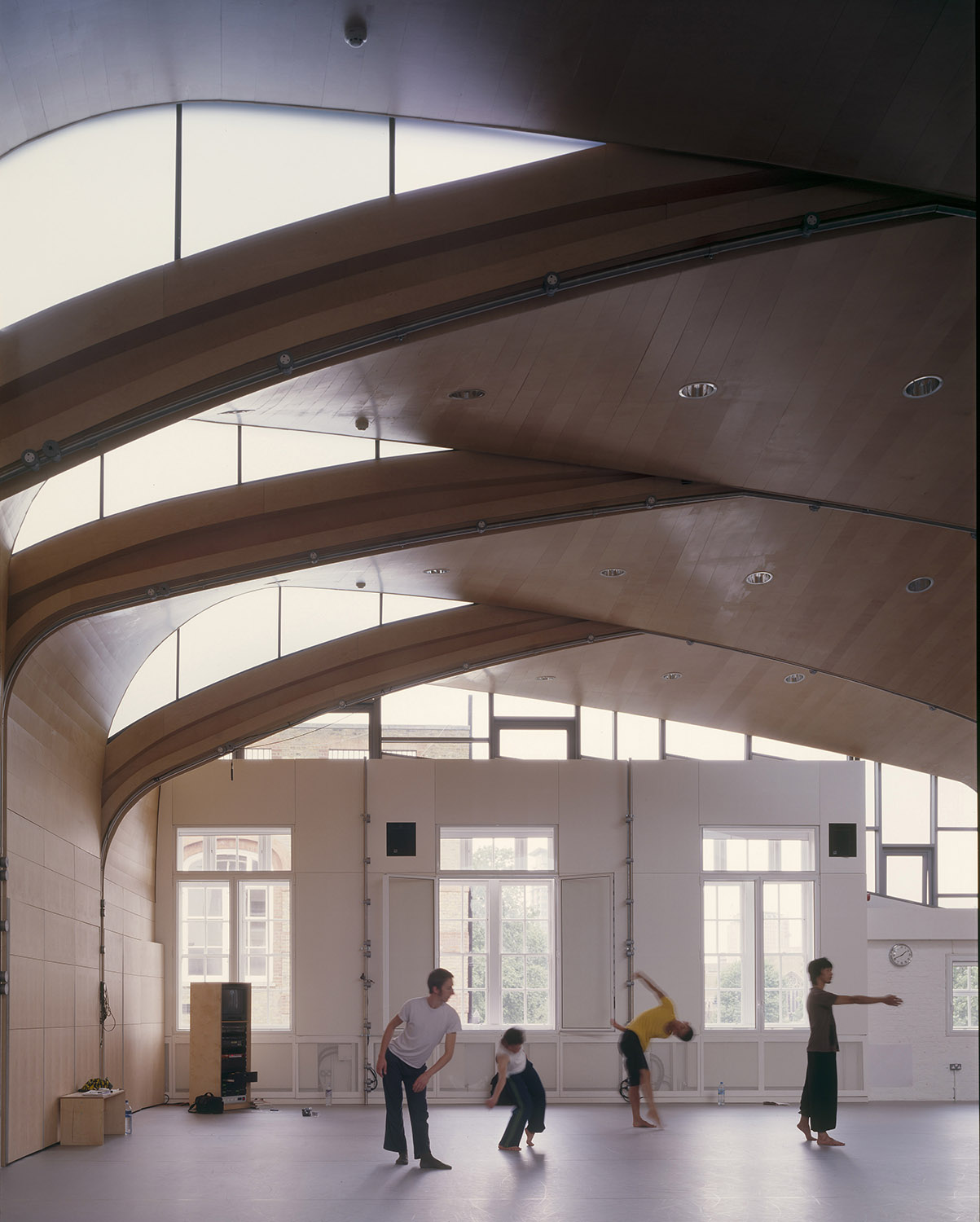 Spacious Roof Studio with curved wooden ceilings for dynamic presentations and events.