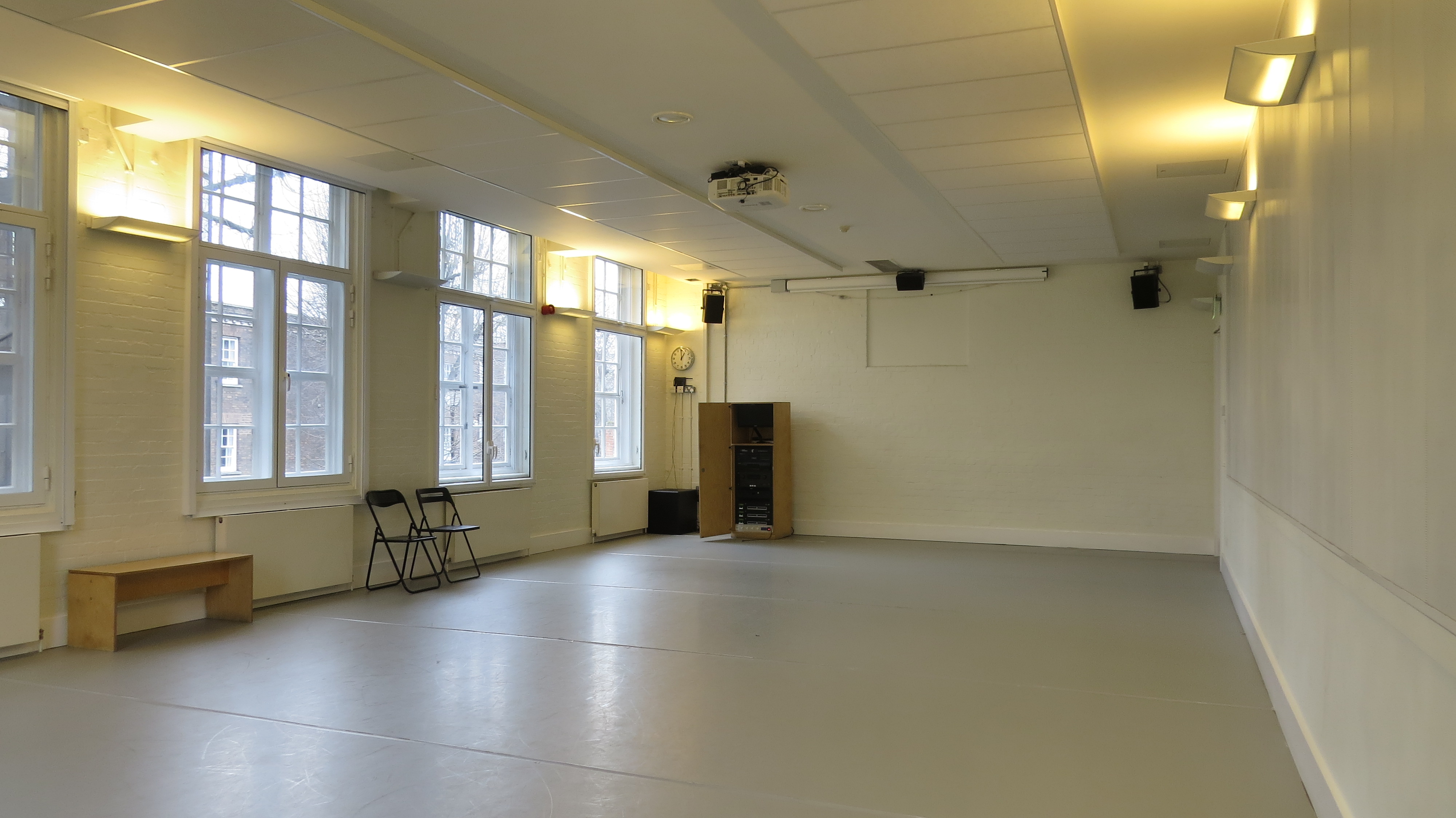 Versatile meeting space at Siobhan Davies Studios with large windows, ideal for workshops and presentations.