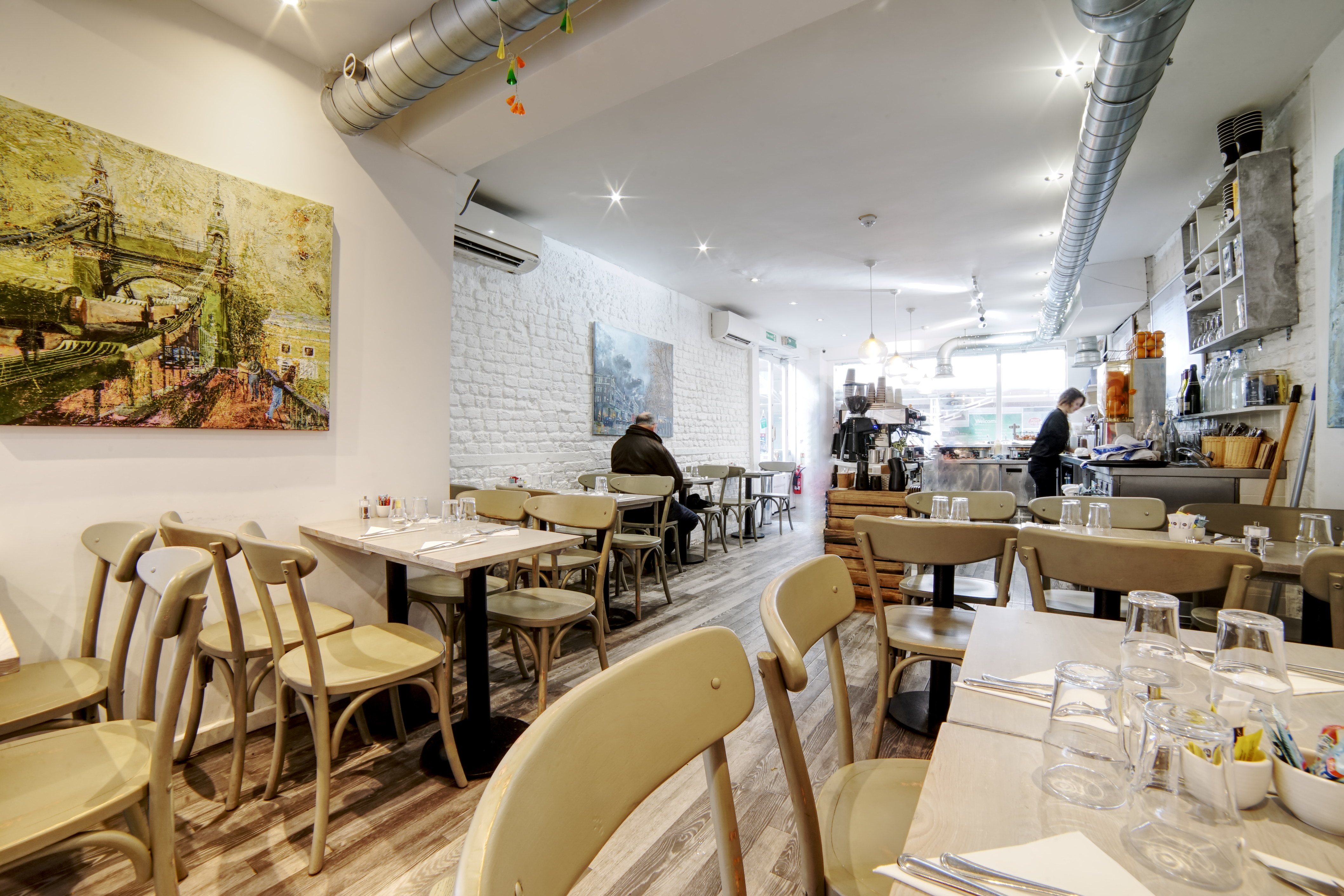 Cozy Chelsea Creperie venue with natural light, ideal for small events and meetings.