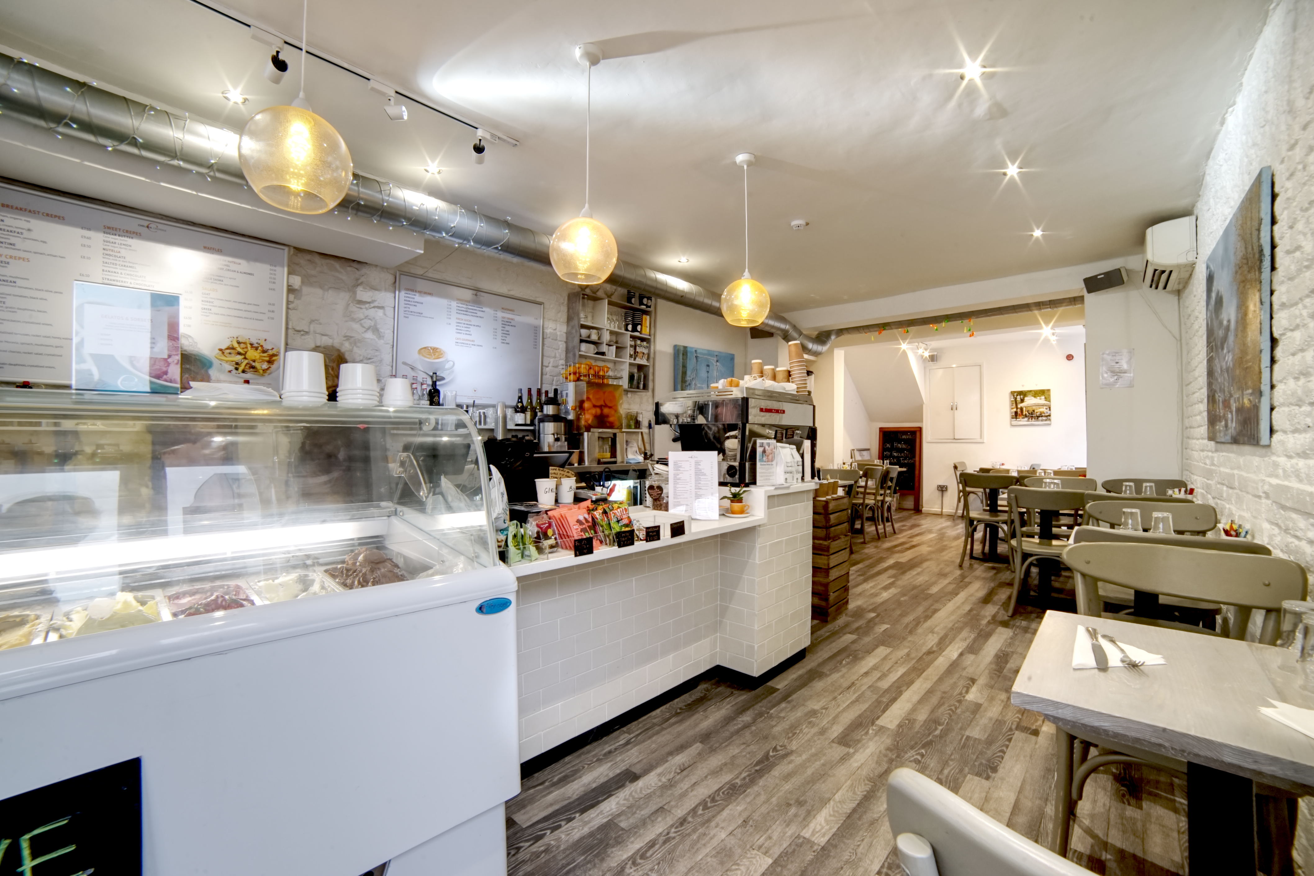 Cozy Chelsea Creperie venue with warm lighting, perfect for small events and meetings.