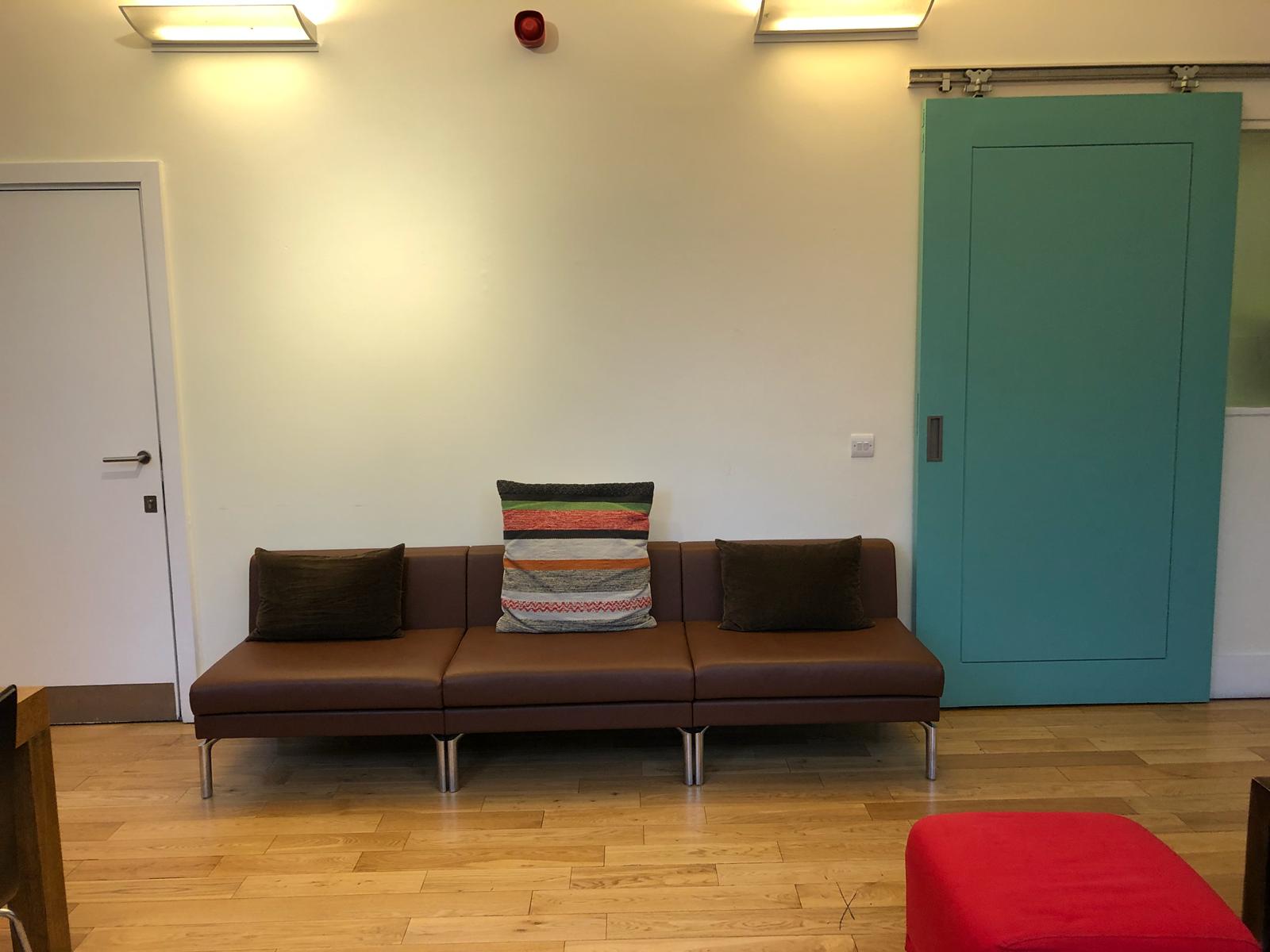 Minimalist seating area at Siobhan Davies Studios for informal meetings and networking.