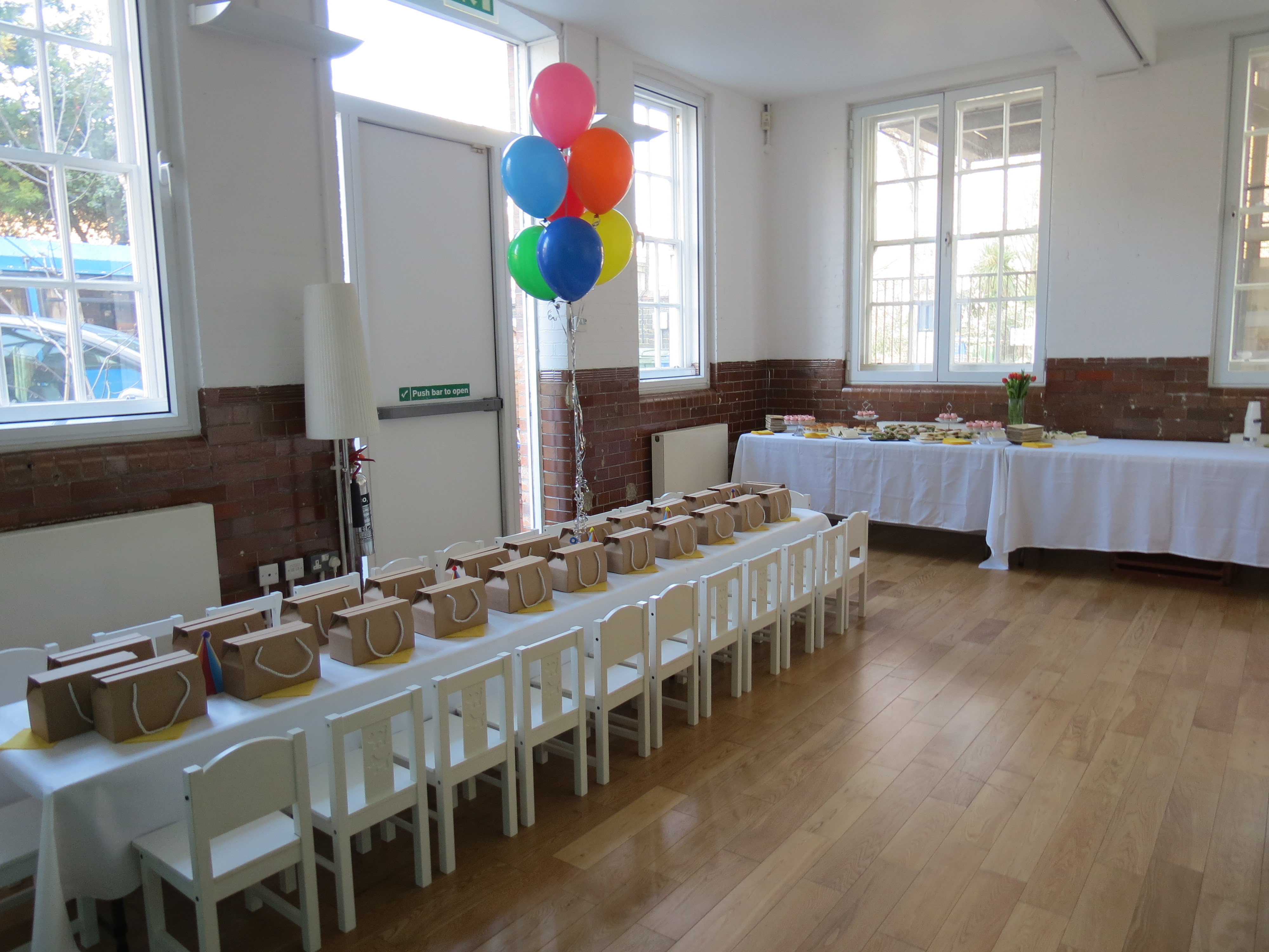 Event space at Siobhan Davies Studios with colorful balloons for a birthday party.