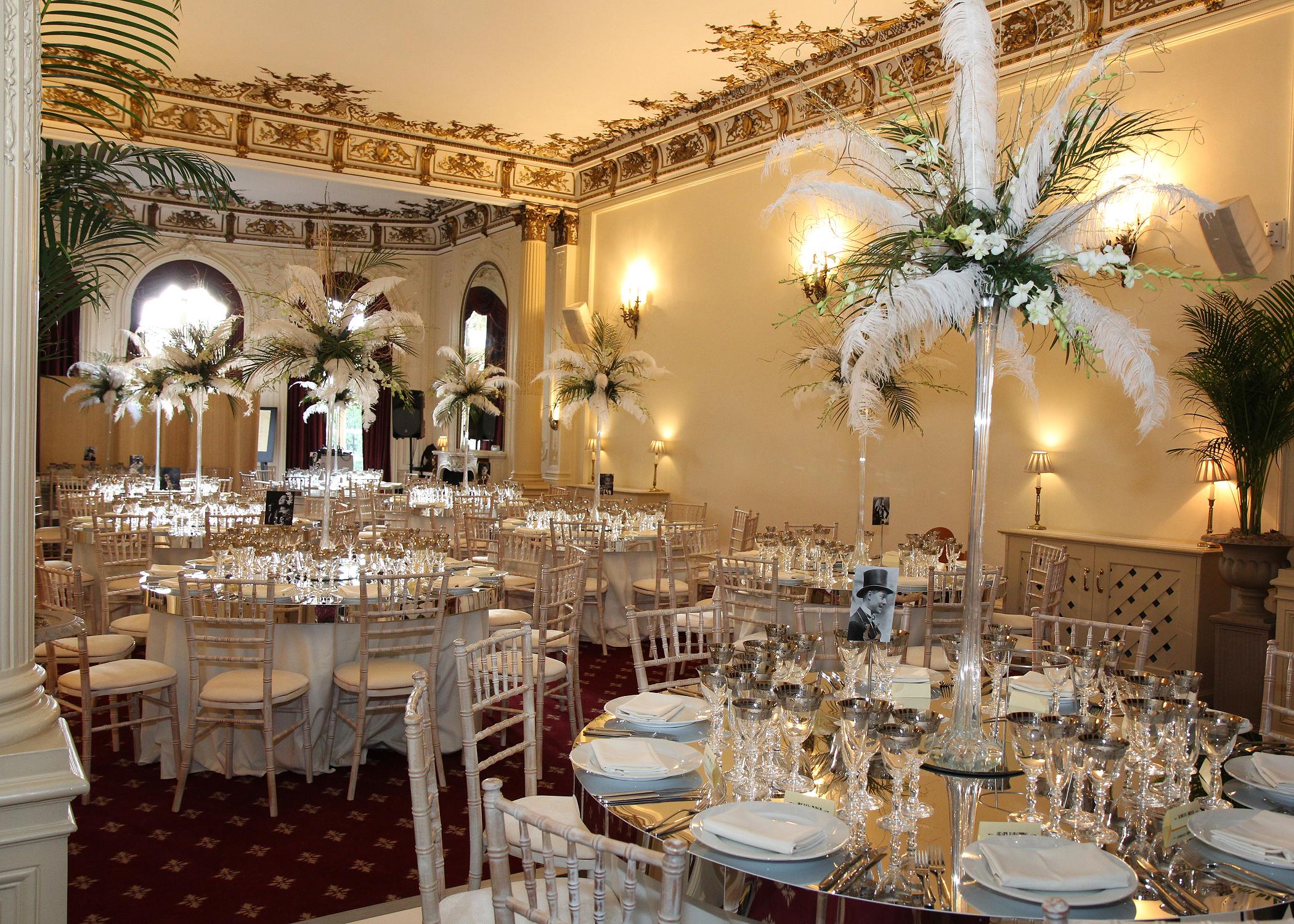 Elegant banquet hall with feather centerpieces for upscale weddings and events.