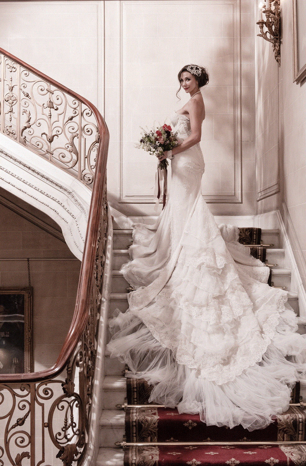 Elegant bride on staircase at No. 4 Hamilton Place, perfect for romantic weddings.