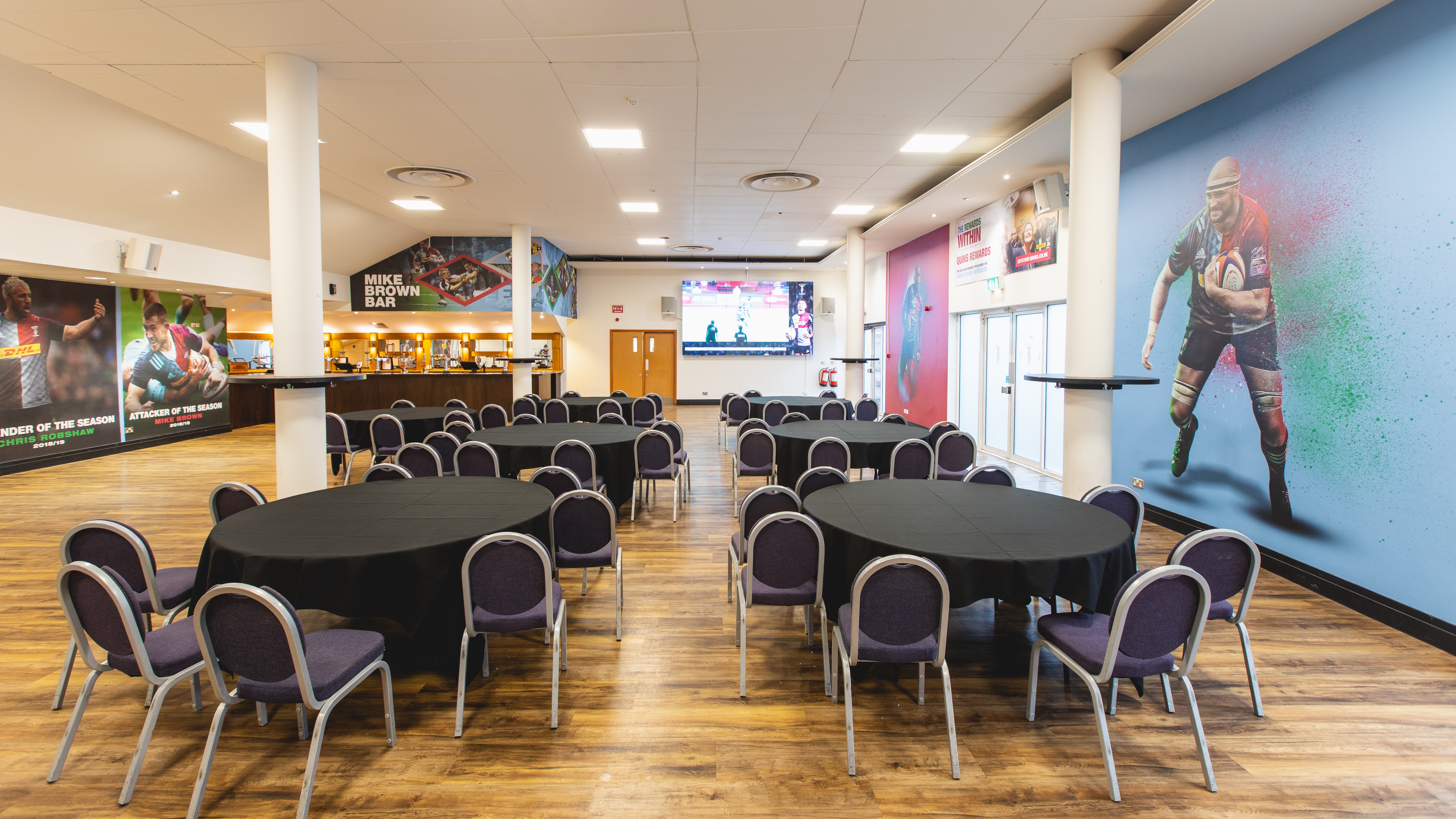 Twickenham Stoop Stadium event space with round tables for meetings and gatherings.