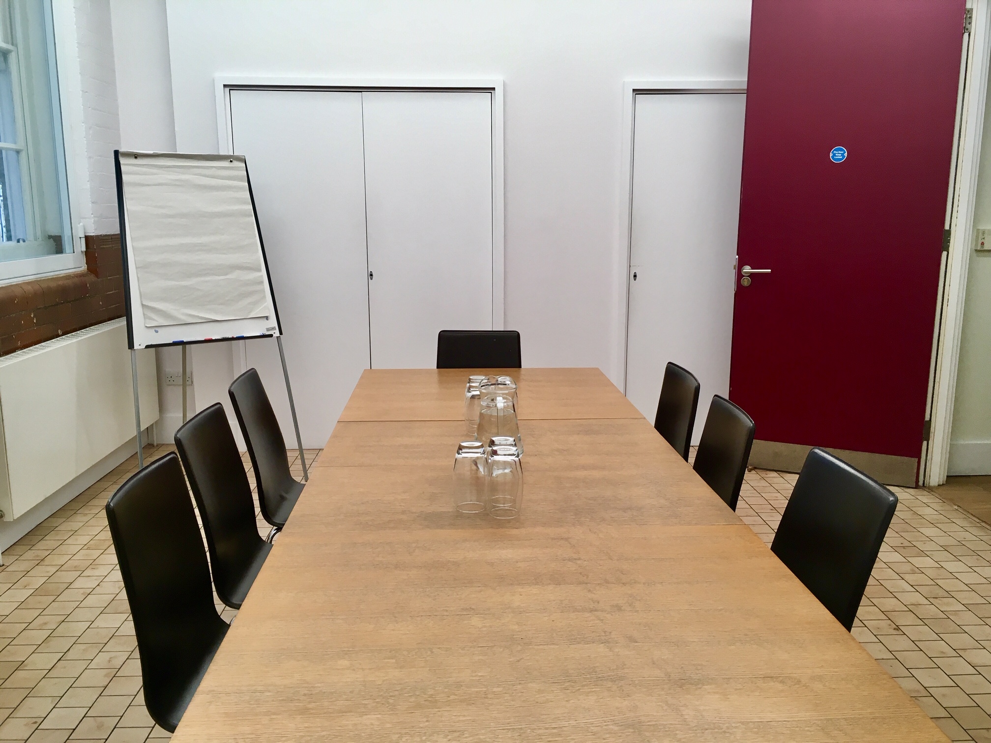 Meeting room at Siobhan Davies Studios with long wooden table for professional events.