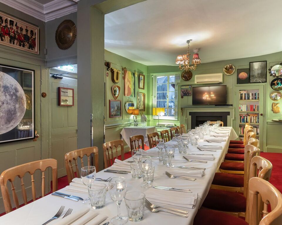 Channing Williams Room dining area with elegant decor for corporate dinners and gatherings.