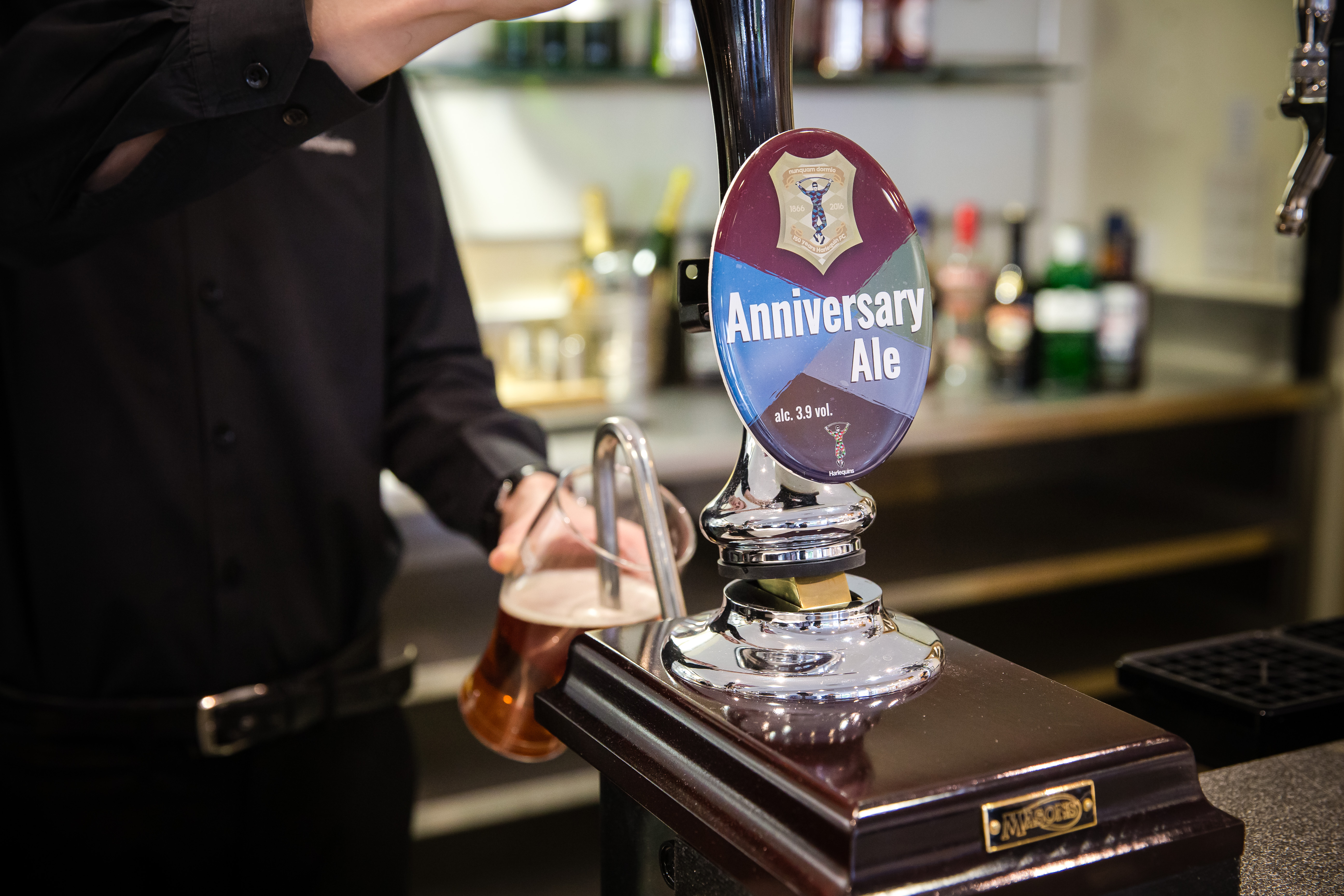 Bartender pouring Anniversary Ale at Chris Robshaw Bar, Twickenham Stoop Stadium event.
