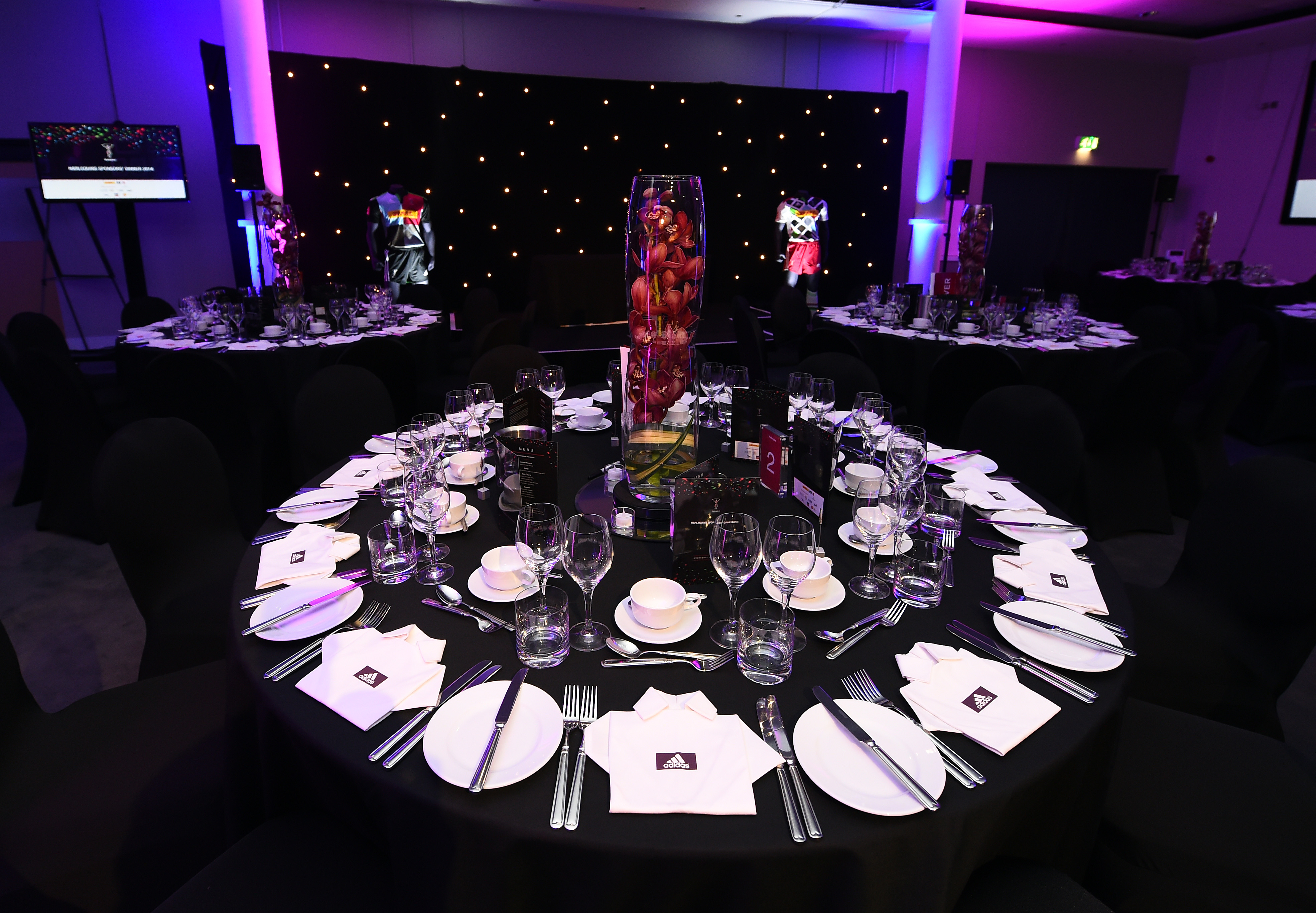 Elegant round table setup at Chris Robshaw Bar for formal dinners and award ceremonies.