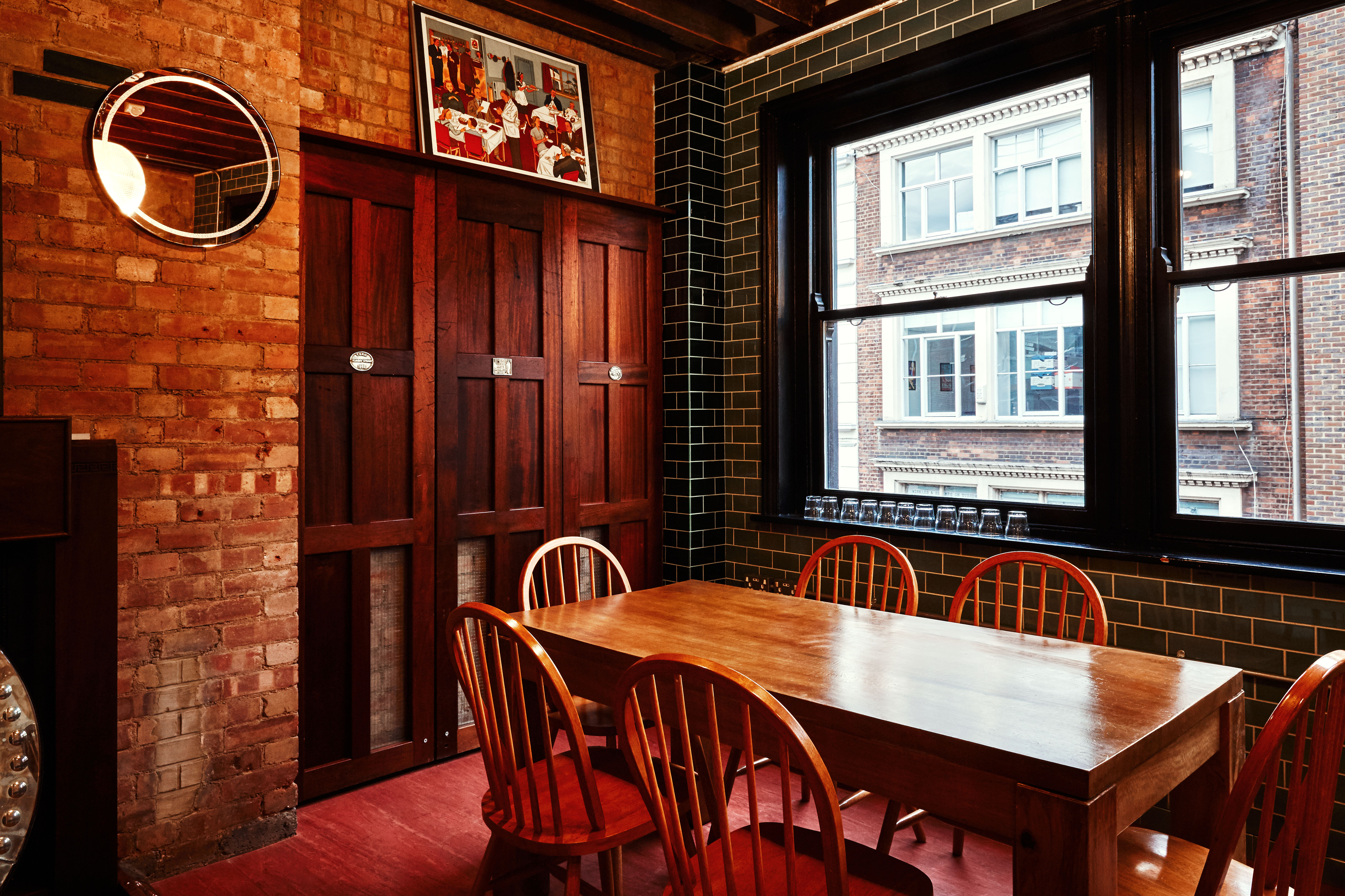 Cozy Writers Room at The Union Club with wooden table, ideal for brainstorming sessions.