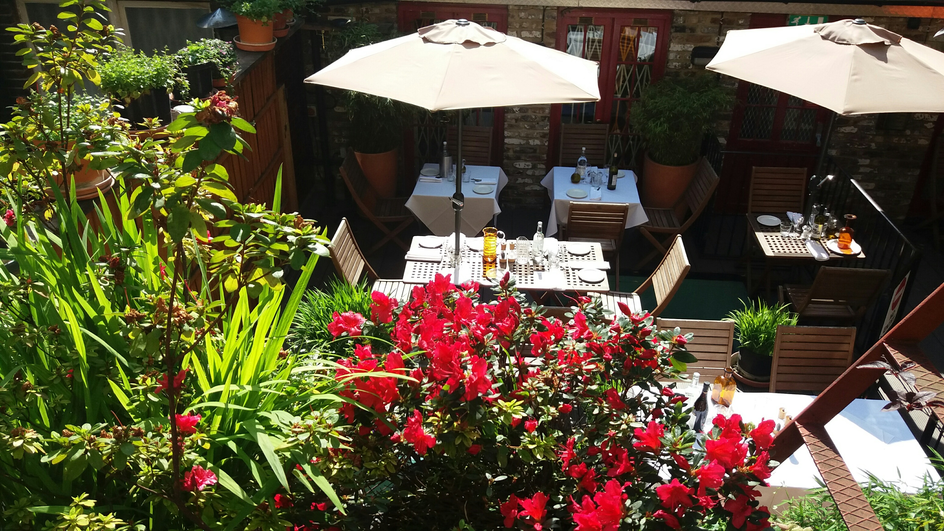 Charming outdoor dining area at The Union Club's Roof Terrace, perfect for events.