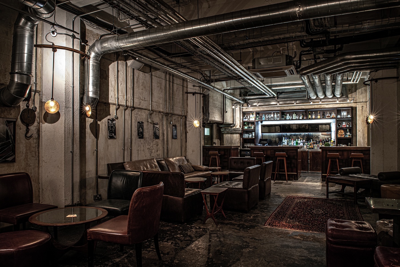 Stylish industrial-chic lounge at Bread Street Kitchen, ideal for networking events.