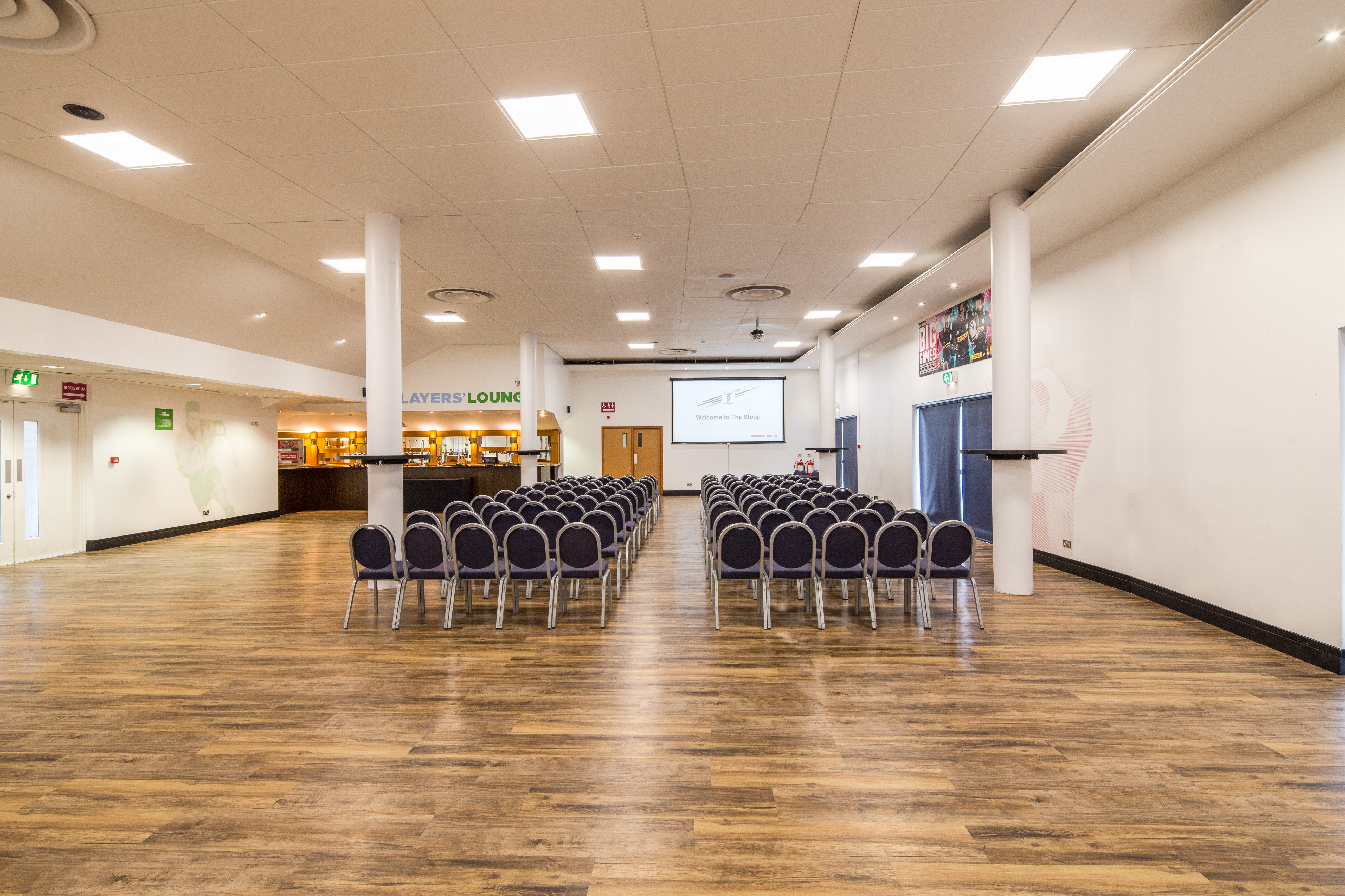 Chris Robshaw at Twickenham Stoop Stadium, set for a conference with modern seating.