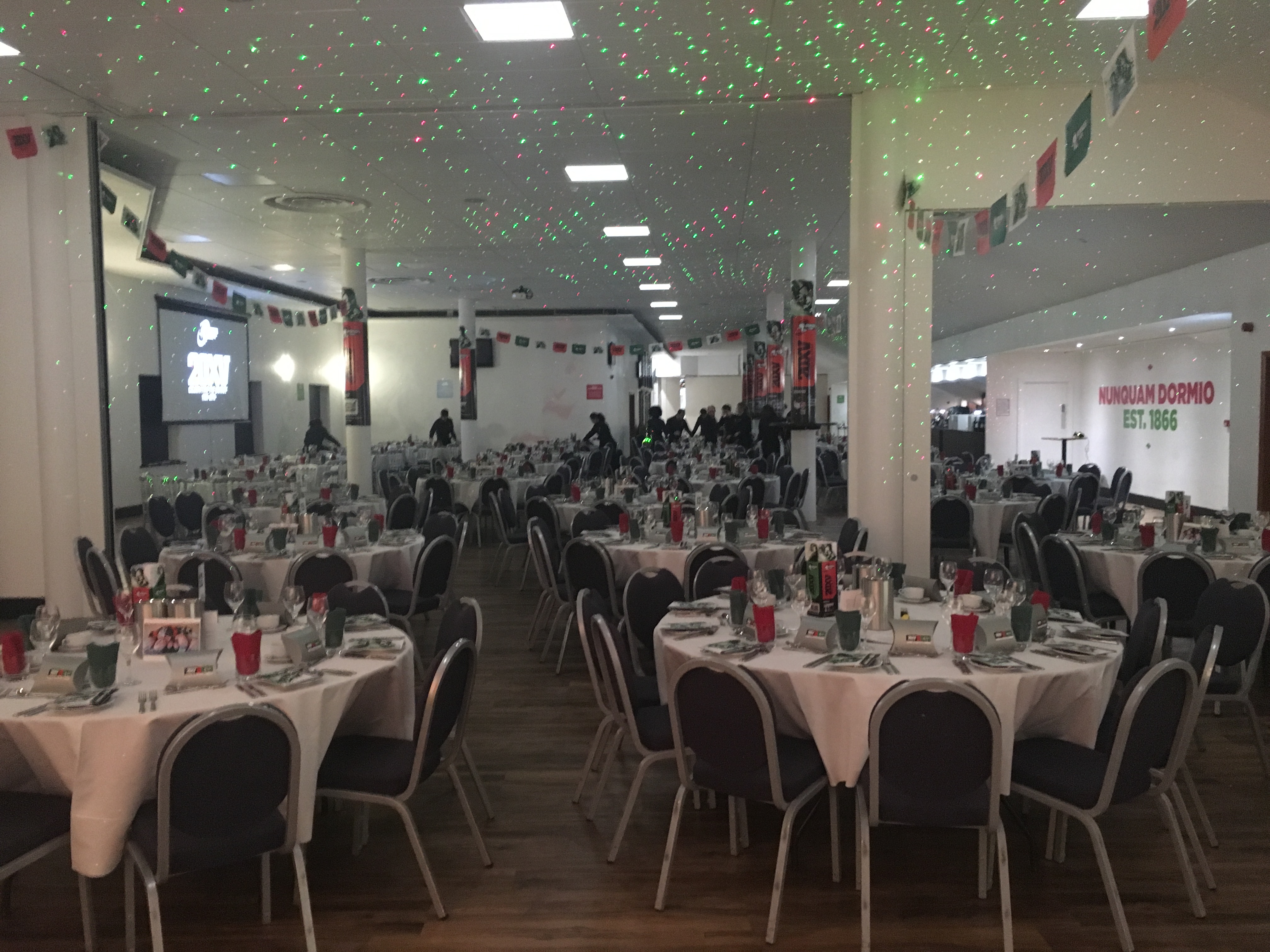 Chris Robshaw at Twickenham Stoop, elegant banquet setup with festive decor and lighting.
