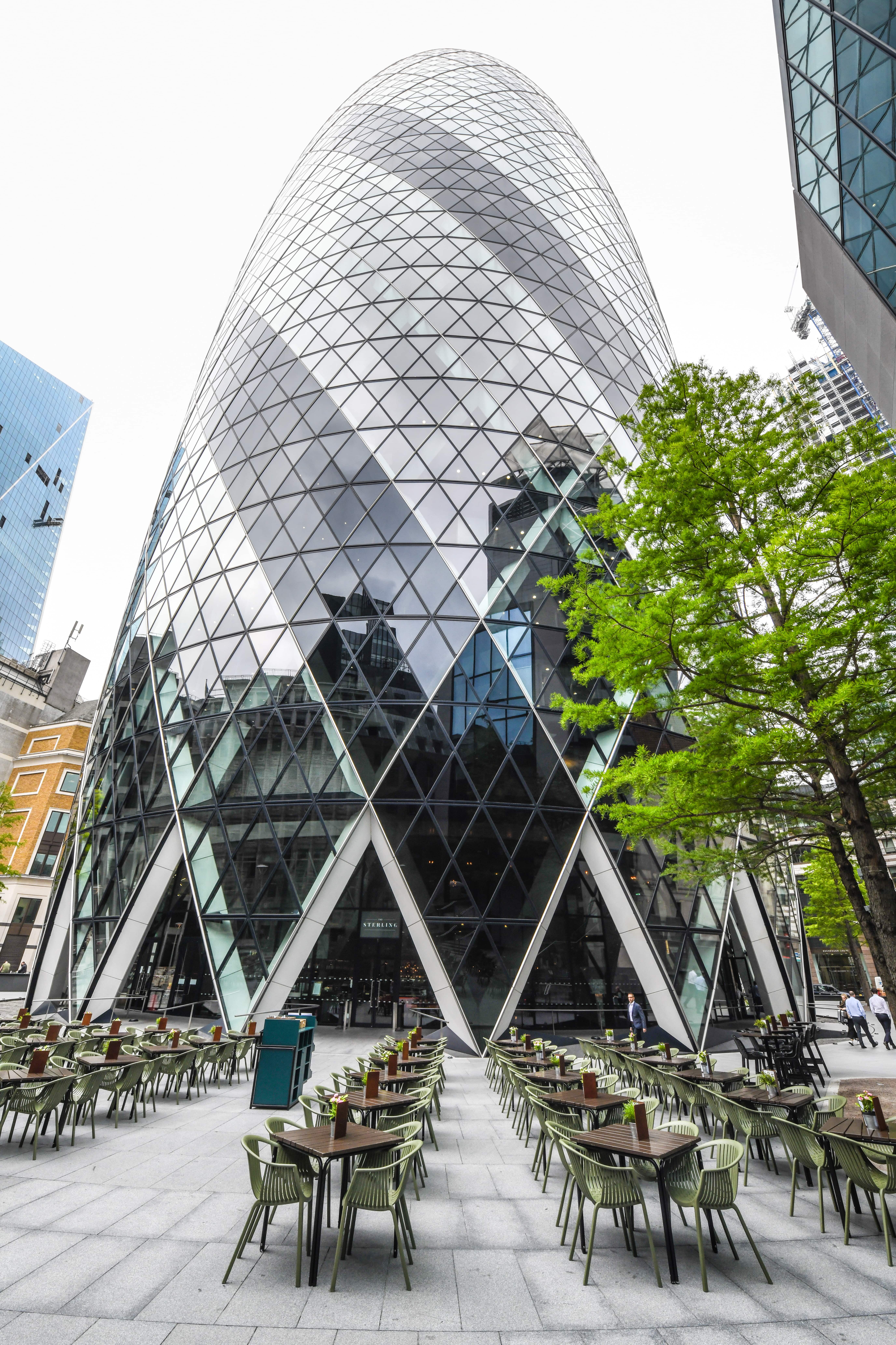 Modern geometric building with glass façade, ideal for corporate events and workshops.