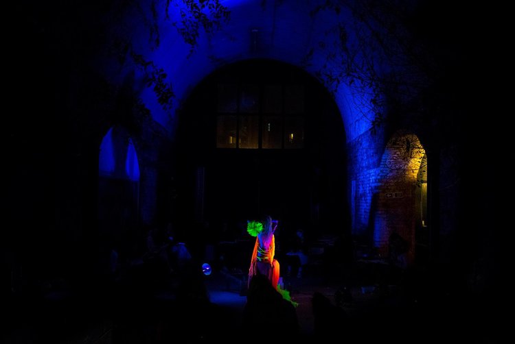 Vibrant performance space with colorful performer at The Doodle Bar Bermondsey event.