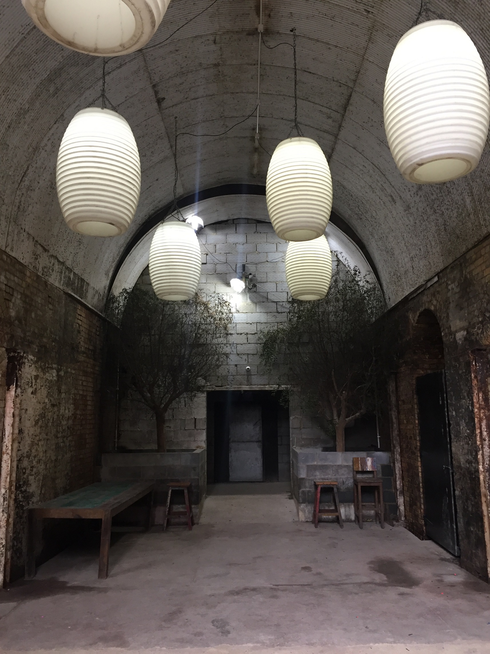 TESTBED1 event space with arched corridor, ideal for workshops and gatherings.