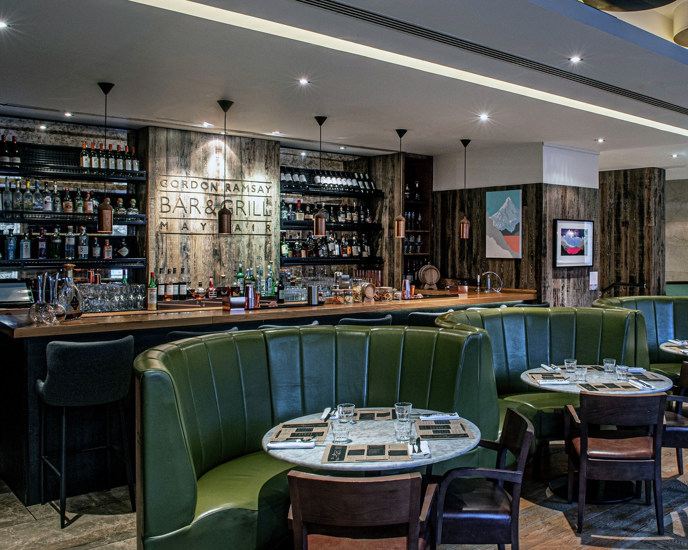 Exclusive Hire at Gordon Ramsay Bar and Grill, stylish bar with plush seating for events.