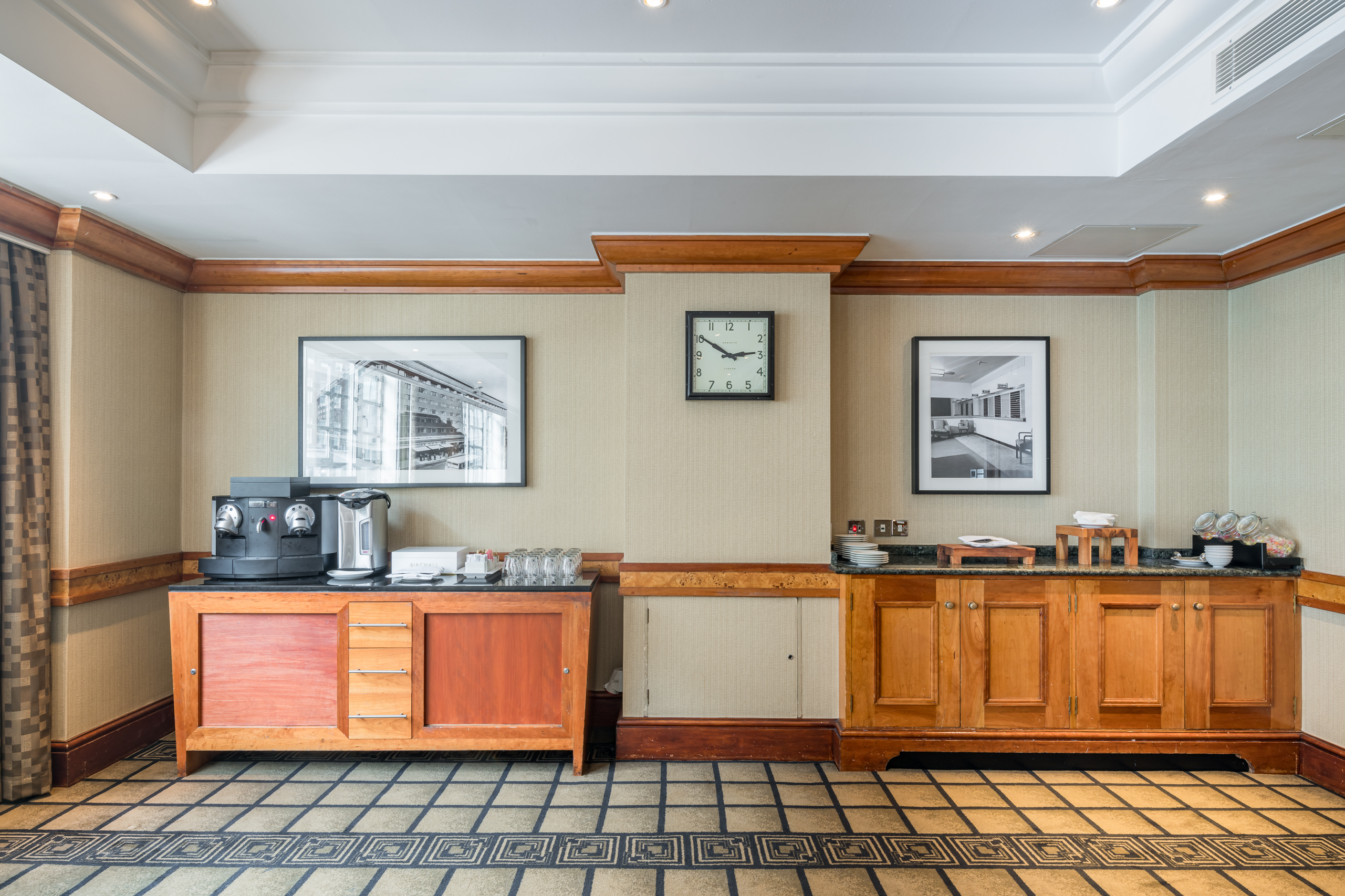 Refreshment station at Bond Street, featuring coffee machine and elegant decor for meetings.
