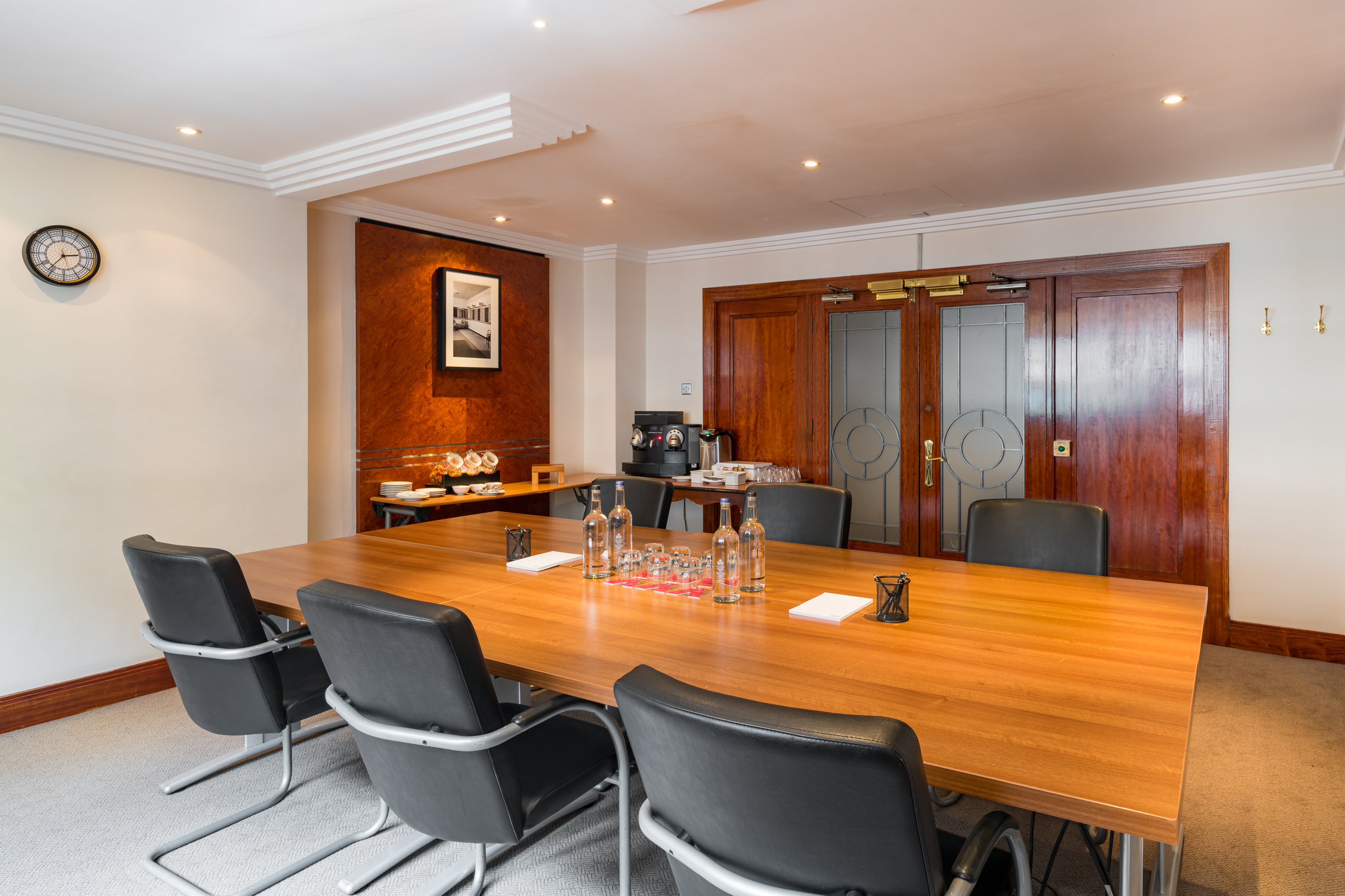 Meeting room at Thistle Marble Arch, featuring a spacious wooden table for professional events.