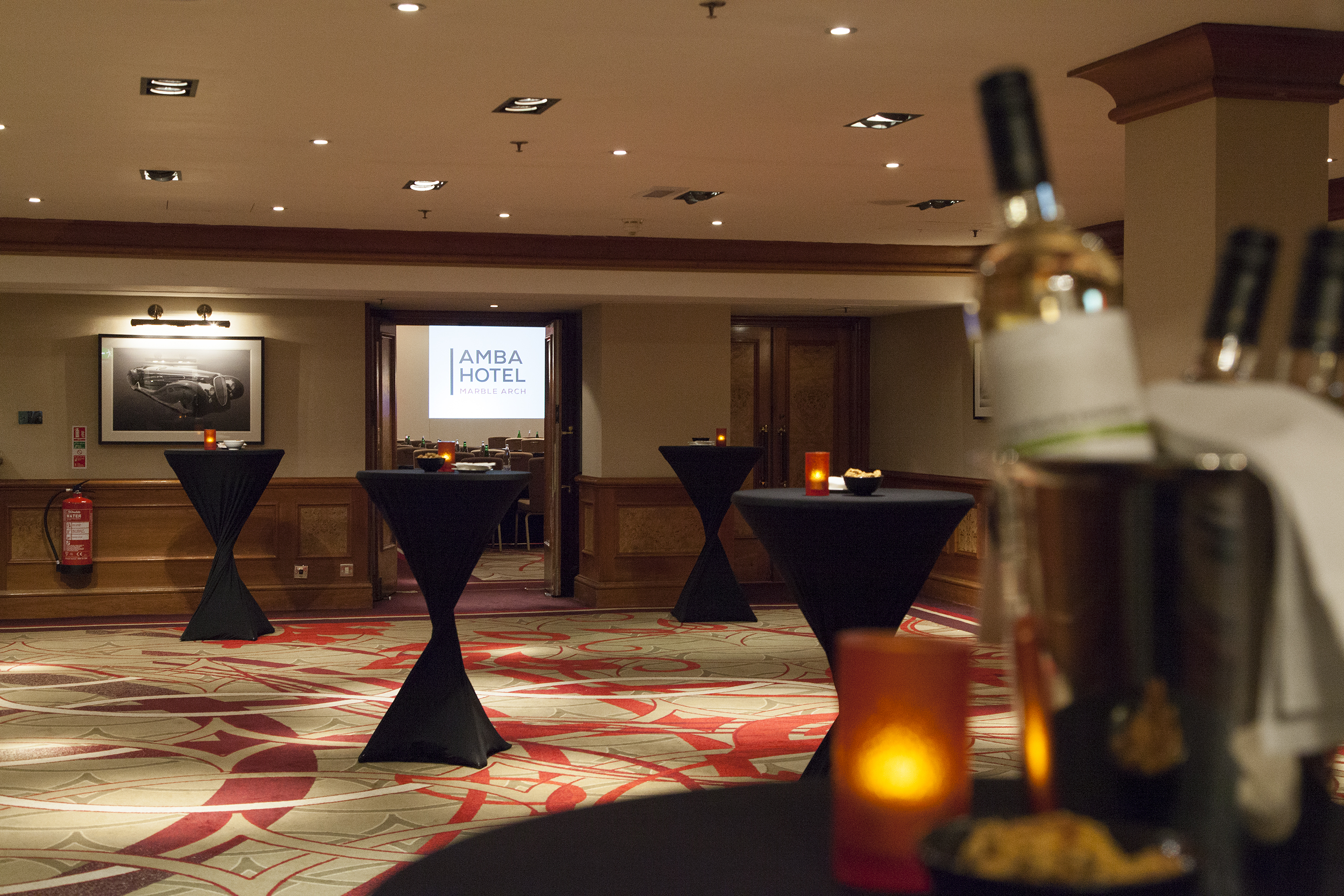 Elegant reception at Albert Hall, Thistle Marble Arch with cocktail tables and ambient lighting.