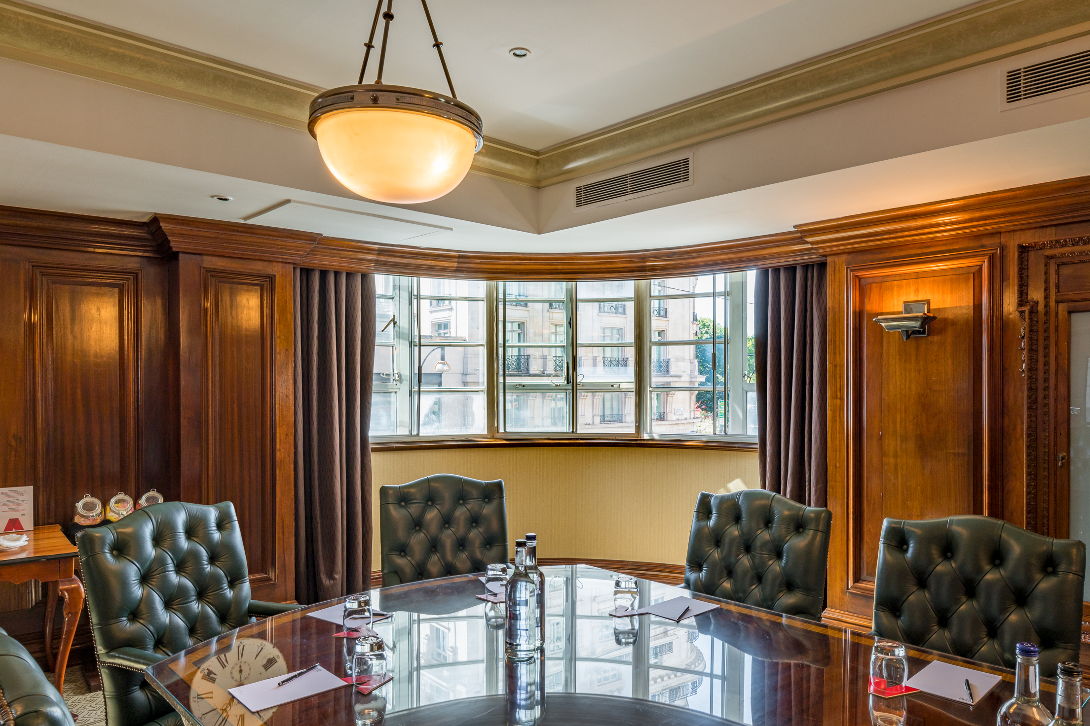 Sophisticated meeting room with wood paneling for strategic discussions at Thistle Marble Arch.