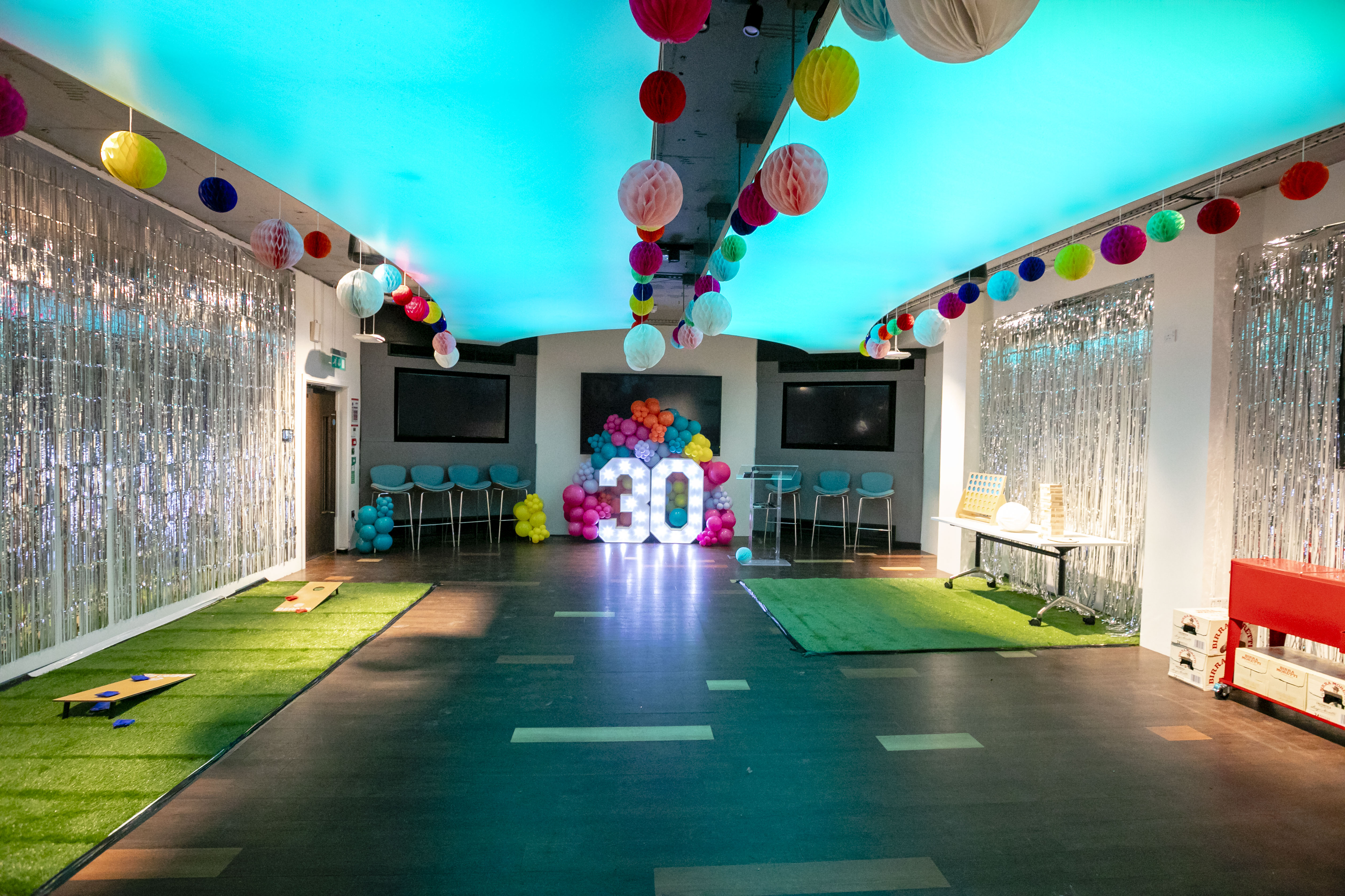 Vibrant event space at IDEALondon for milestone birthday celebrations with colorful decor.