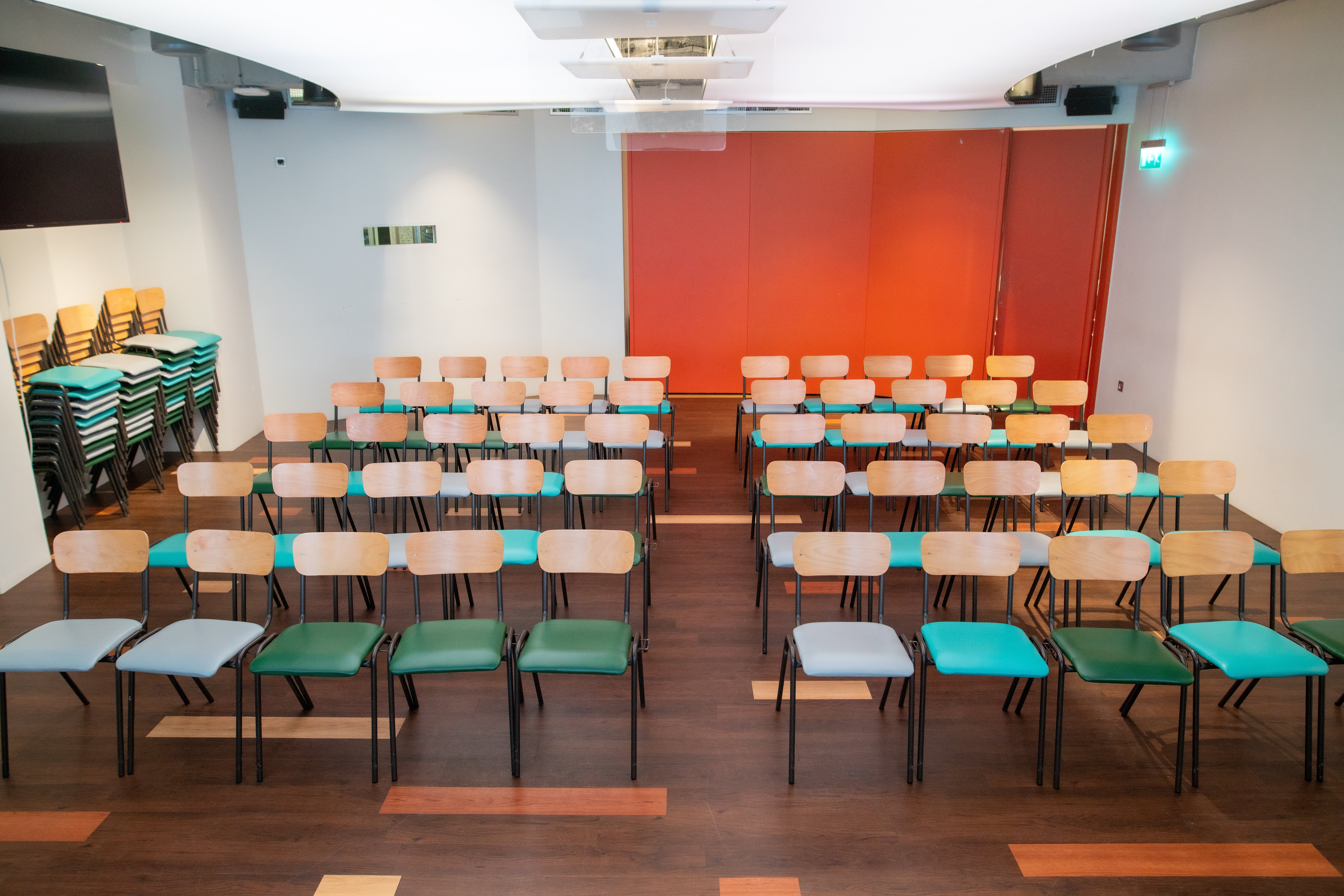 Event space at IDEALondon with modern chairs set for a professional meeting or presentation.