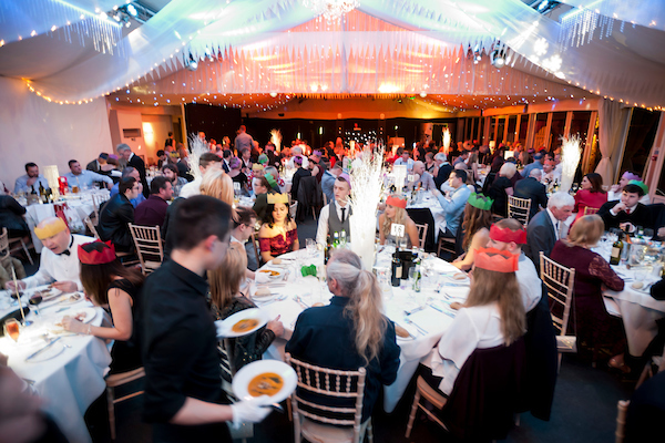 Festive dinner at Braxted Park with elegant table settings for corporate events.