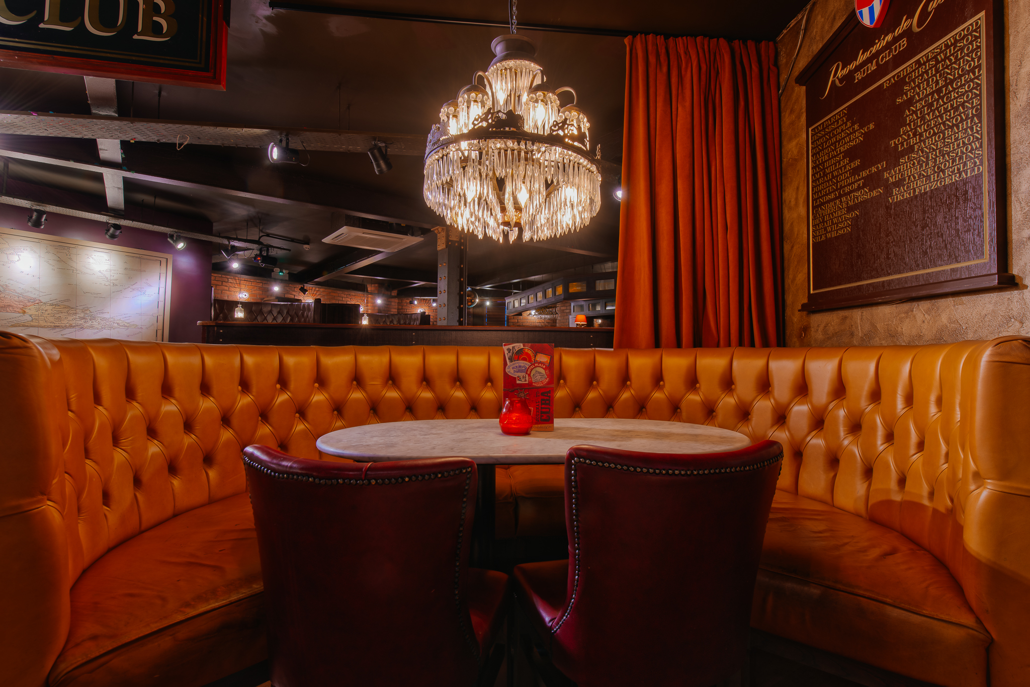 Bacardi Bar seating area with plush booths, ideal for networking events in Leeds.