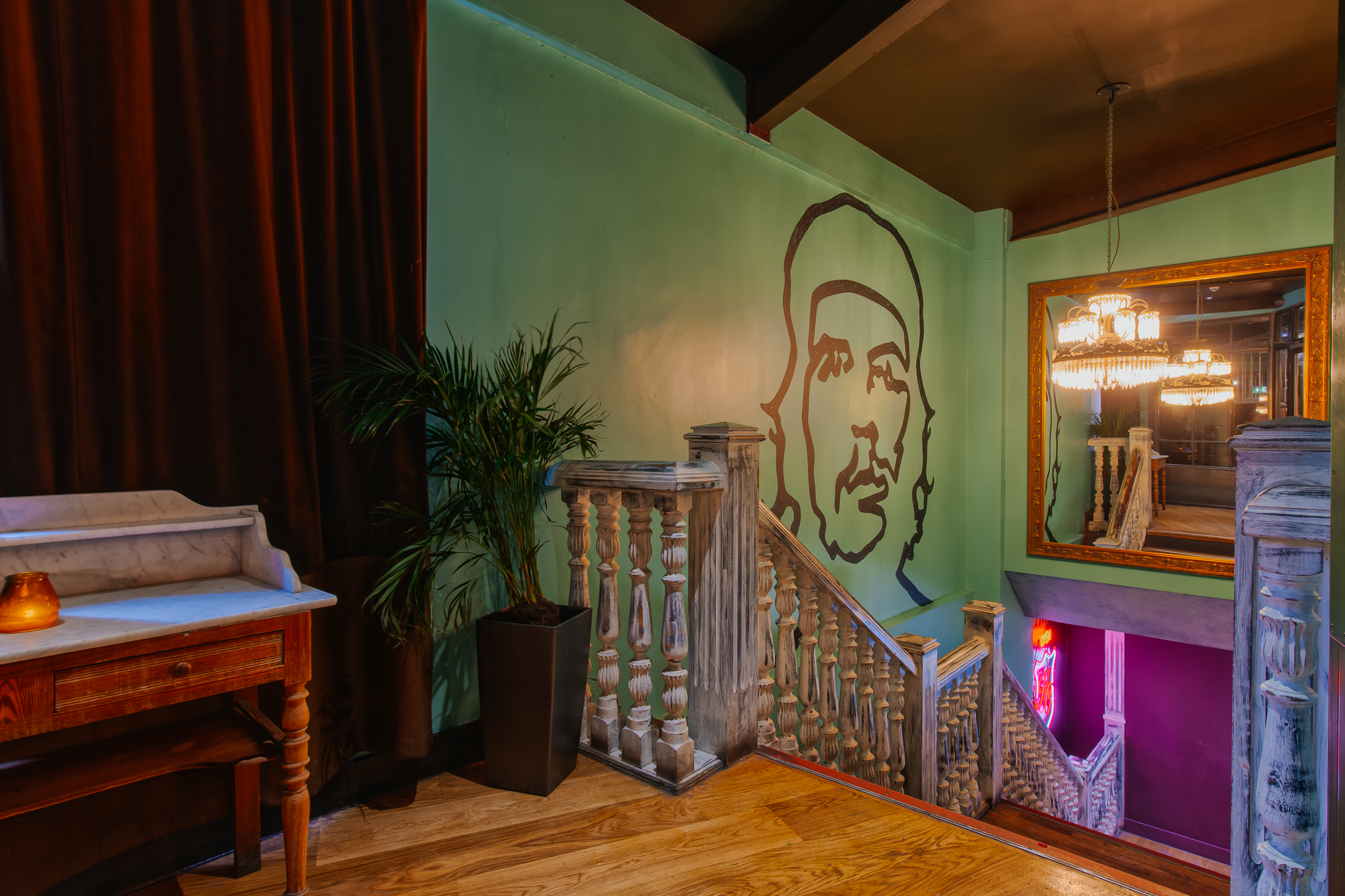 Vibrant Bacardi Bar staircase with Che Guevara mural, perfect for events and gatherings.
