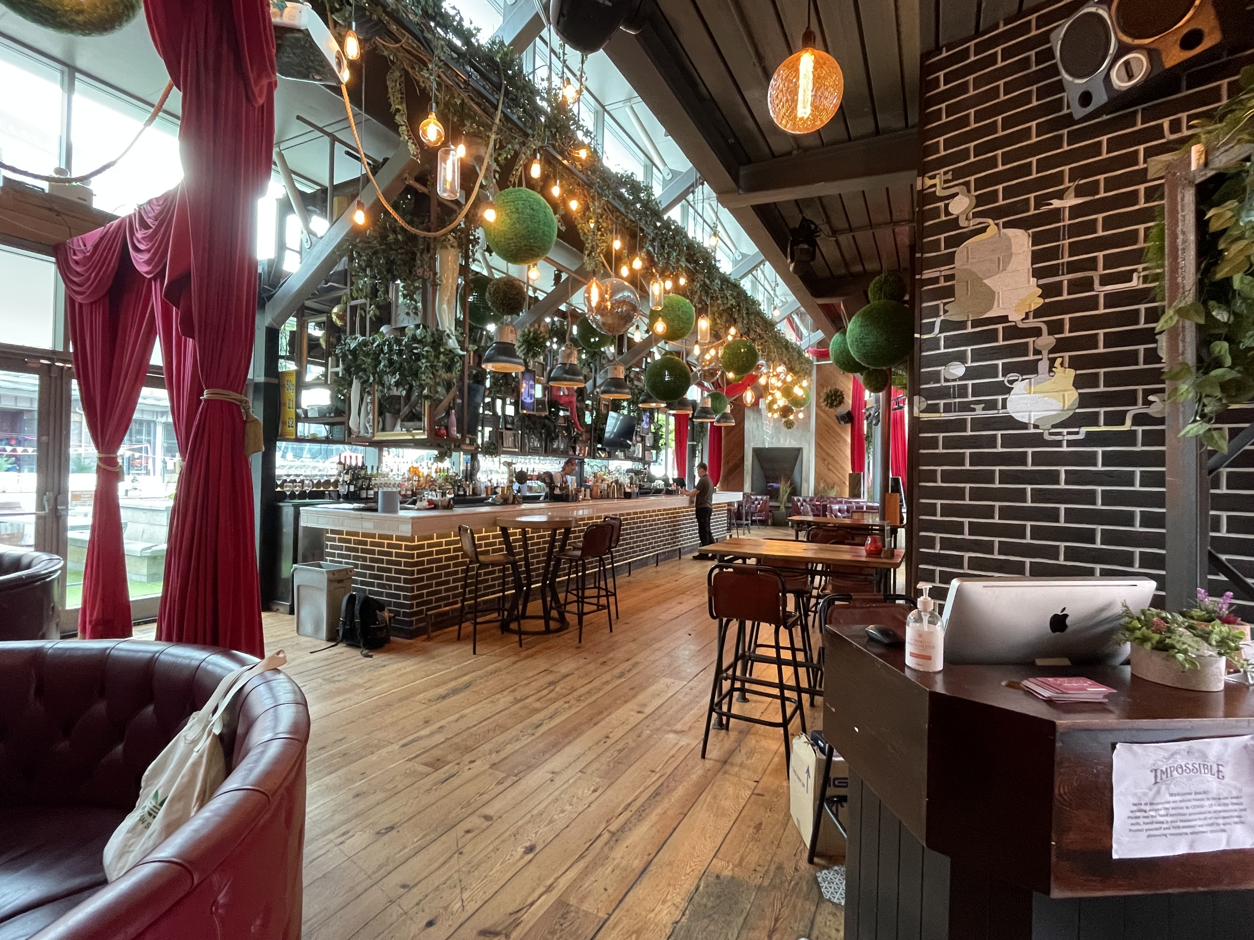 Vibrant Impossible Main Bar in Manchester, ideal for events with stylish decor and seating.
