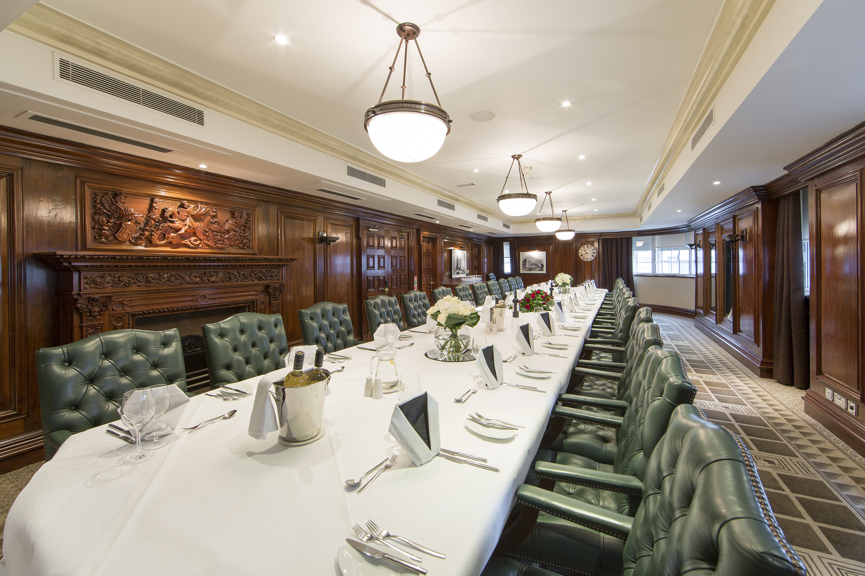 Sophisticated meeting room with elegant wooden paneling for executive events.