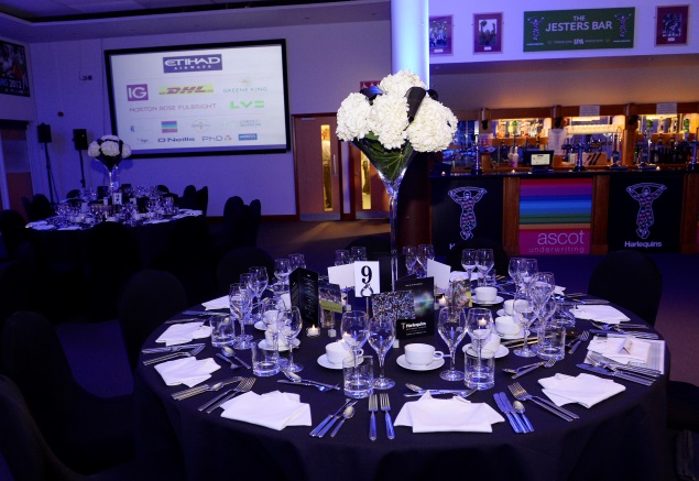 Elegant banquet table with floral centerpiece at Twickenham Stoop for corporate gala.