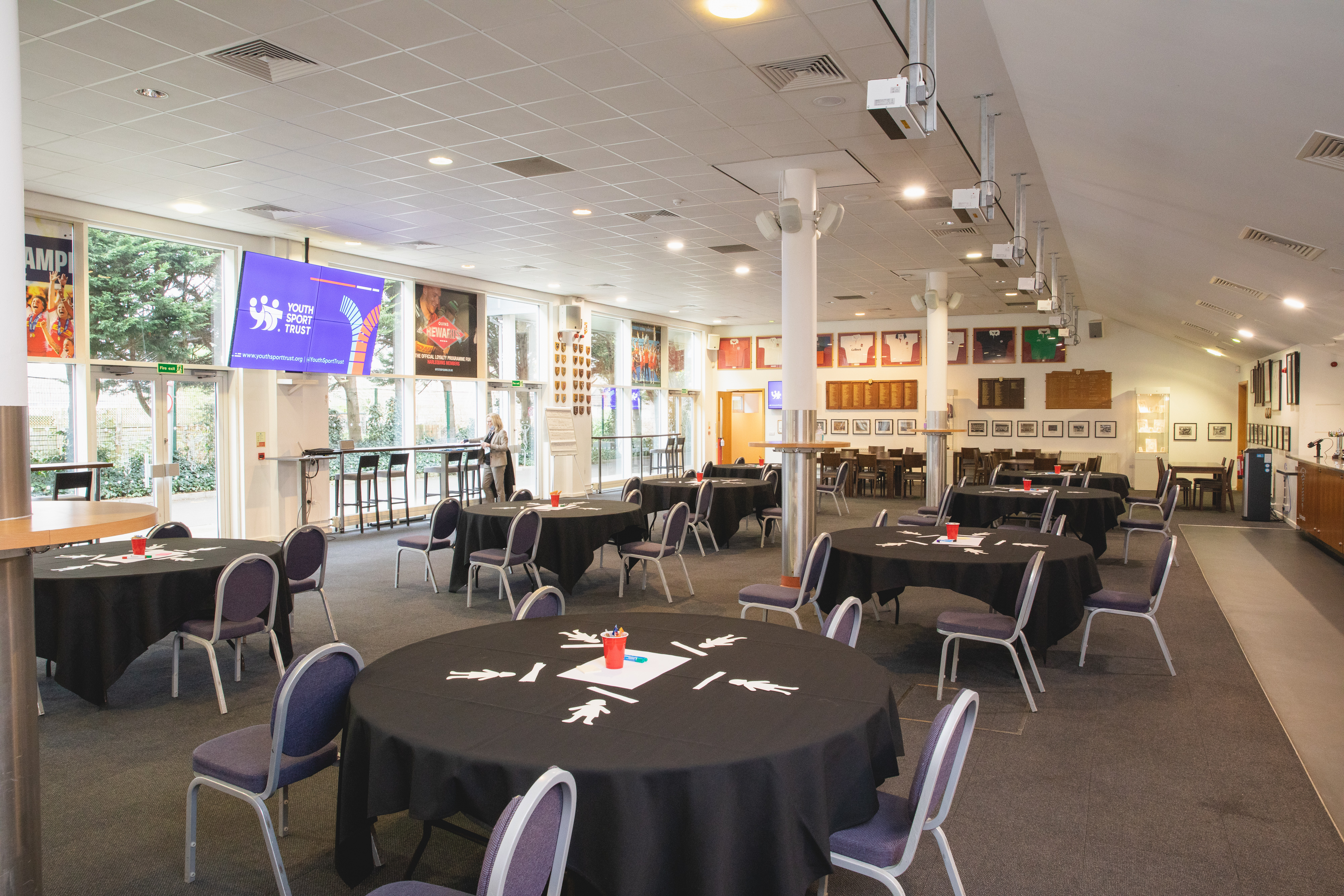 The Honours Bar at Twickenham Stoop, set for a meeting with round tables and AV tech.