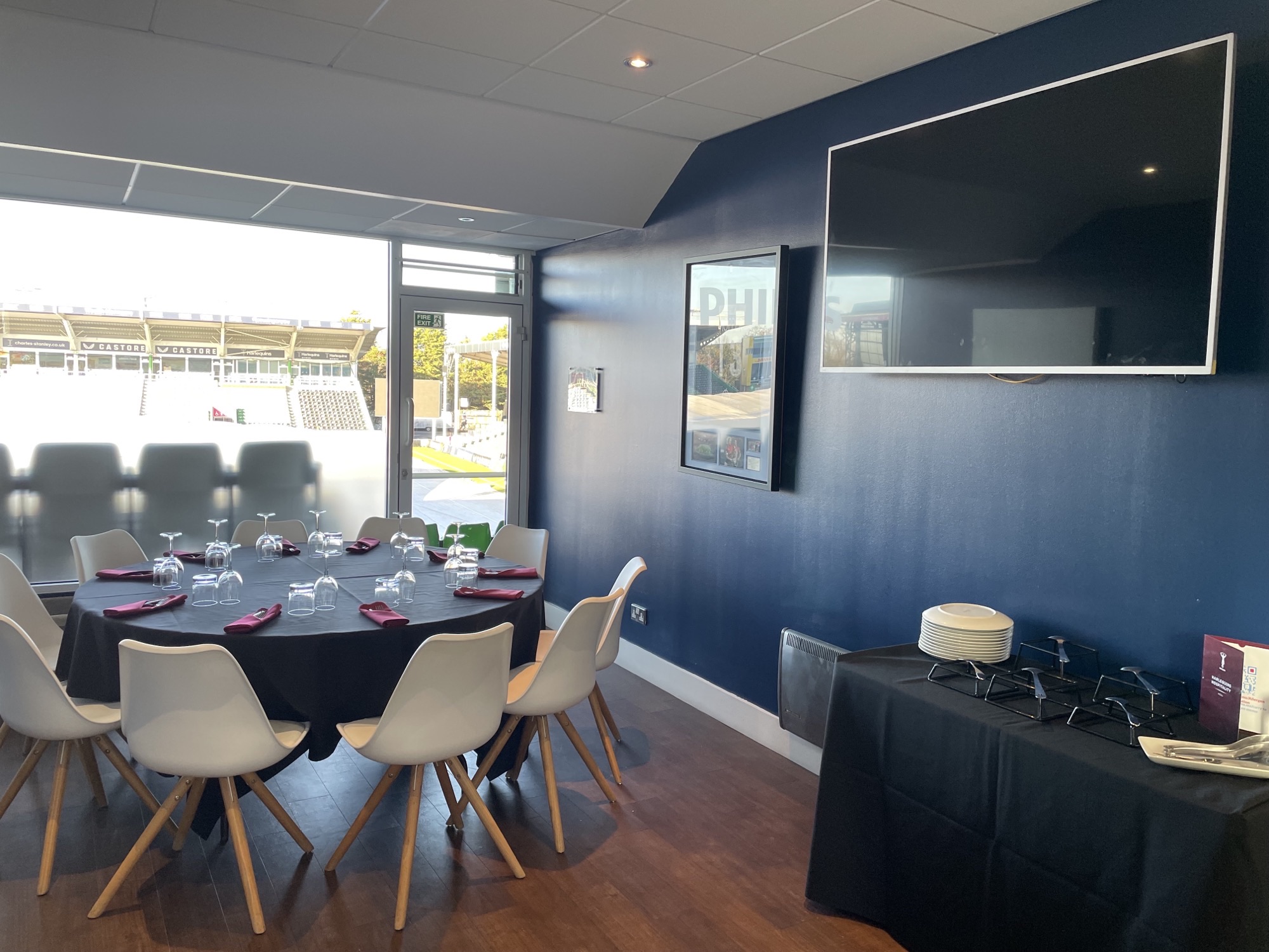 Single Executive Box at Twickenham Stoop, elegant round table for corporate meetings.