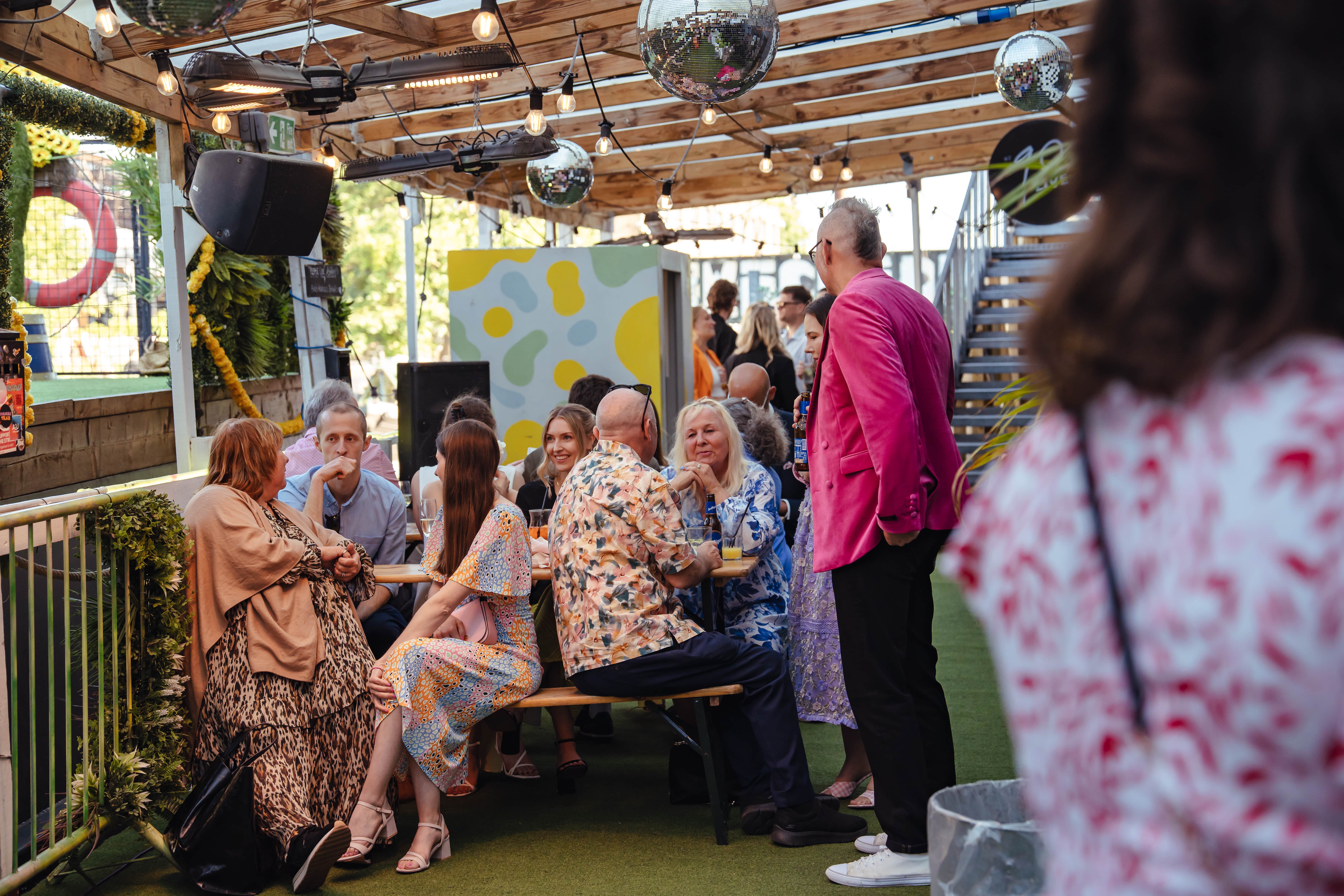 Outdoor networking event at 90 Hideout, Hackney Wick with inviting decor and vibrant atmosphere.