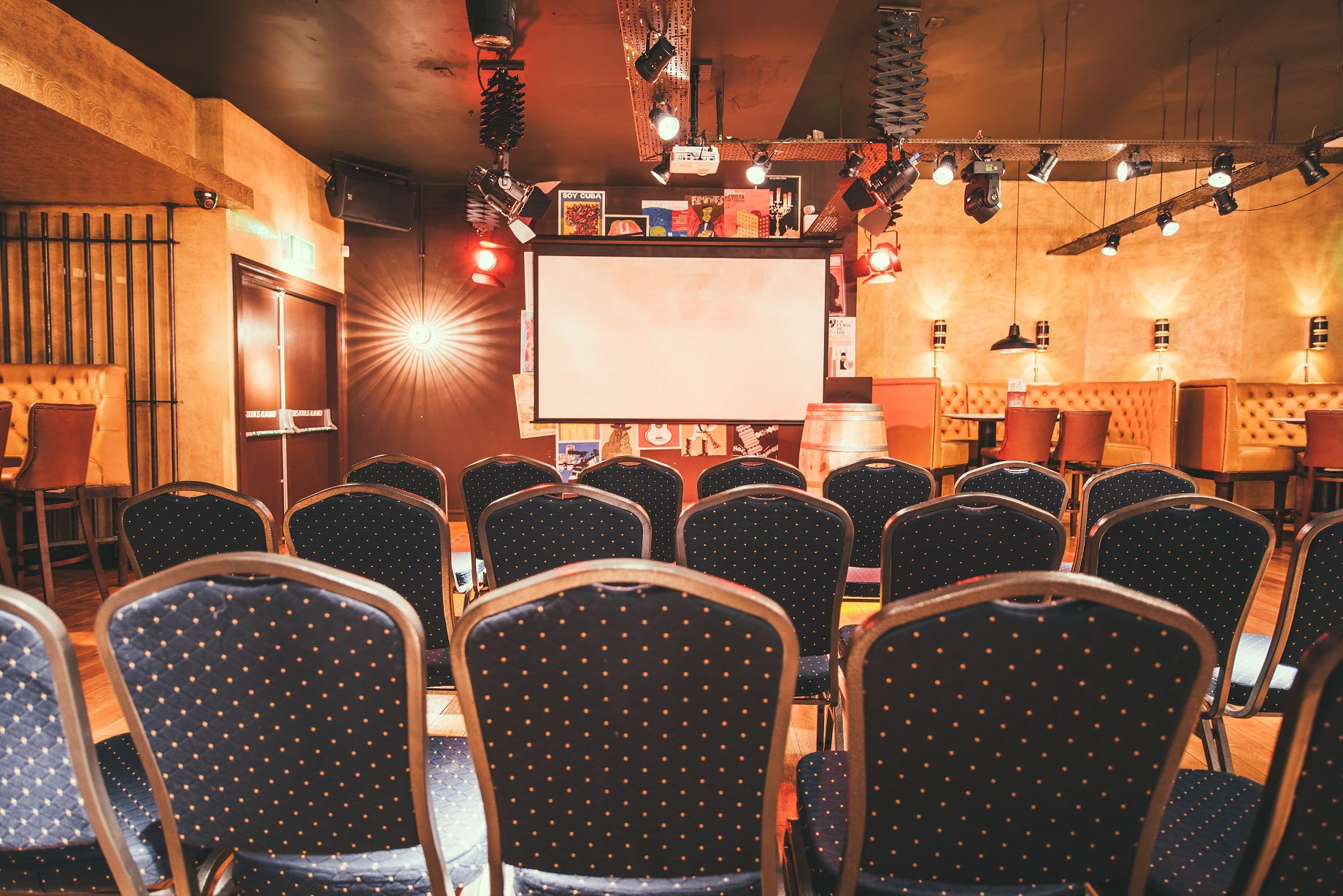 Casa De La Musica event space with chairs and projection screen for presentations in Nottingham.