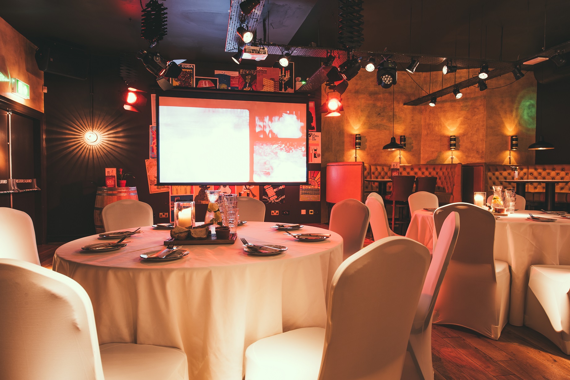 Casa De La Musica event space with elegant tables, ideal for meetings and celebrations.