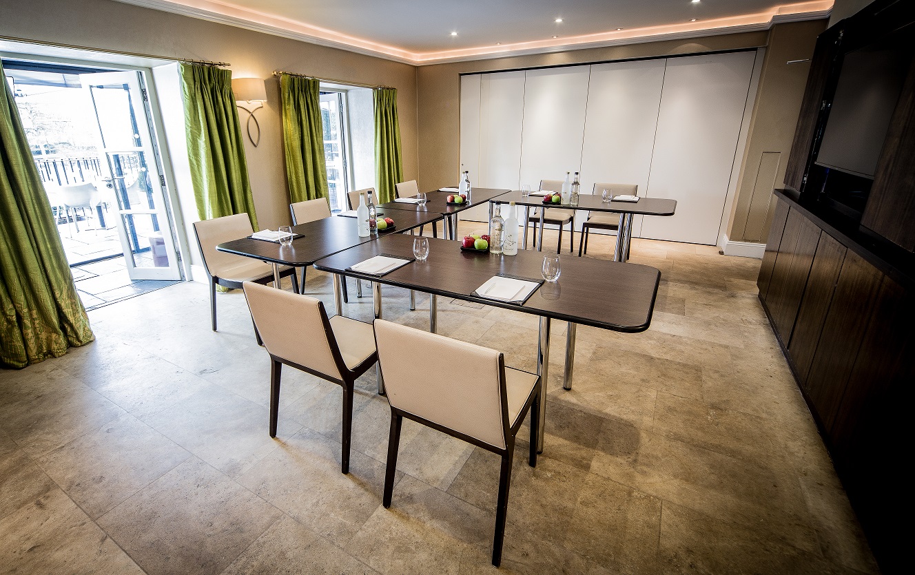 Garden Room 2 at The Bingham, modern meeting space with natural light and greenery.