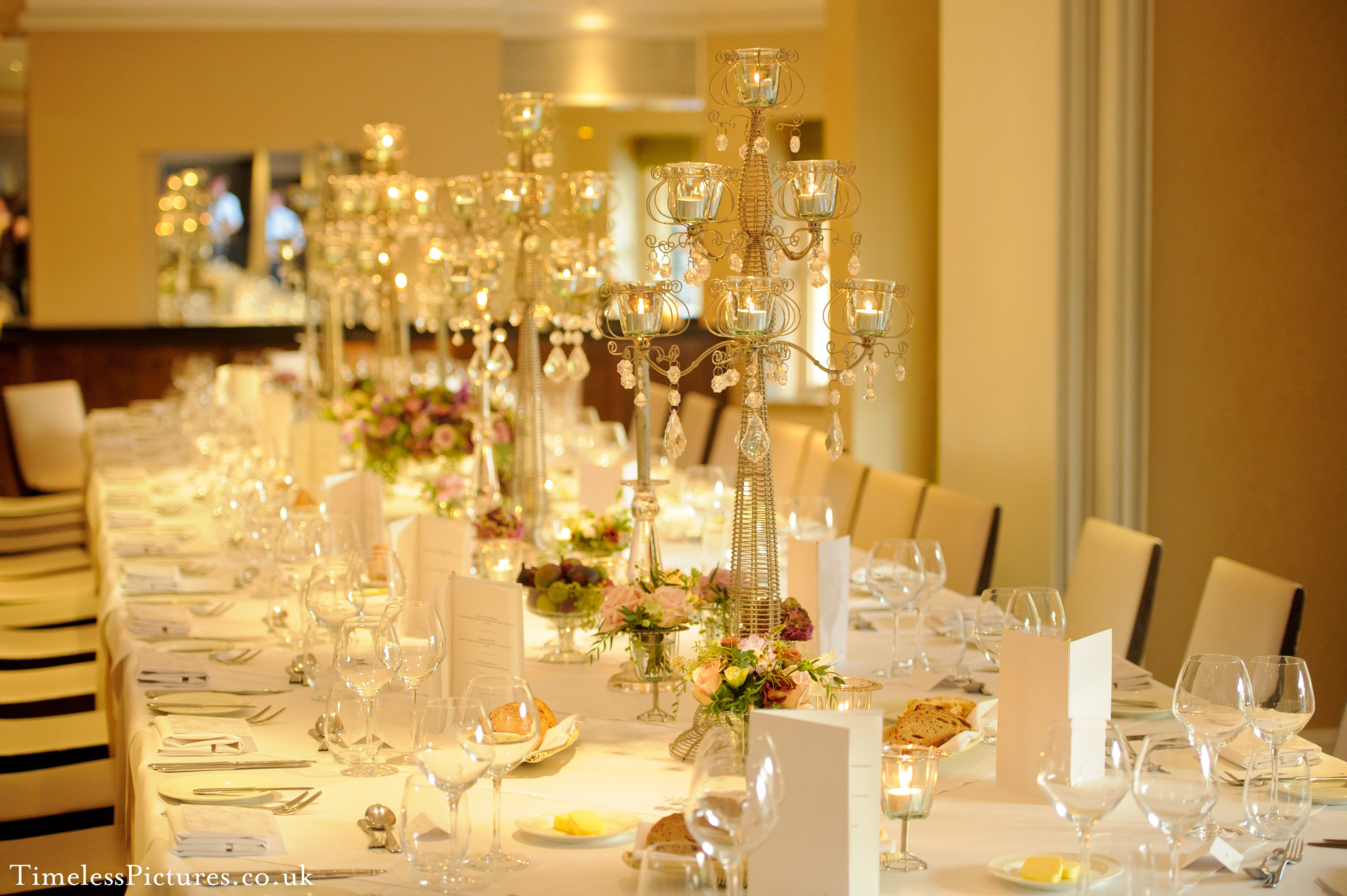 Elegant dining table with candelabras in The Bingham's Garden Room 2 for formal events.