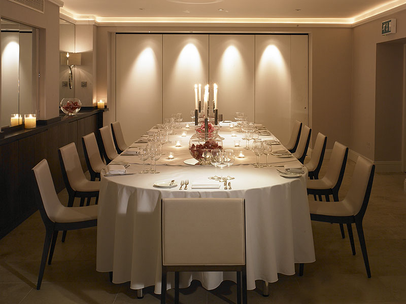 Elegant dining setup in Garden Room 2 for intimate corporate dinners and events.