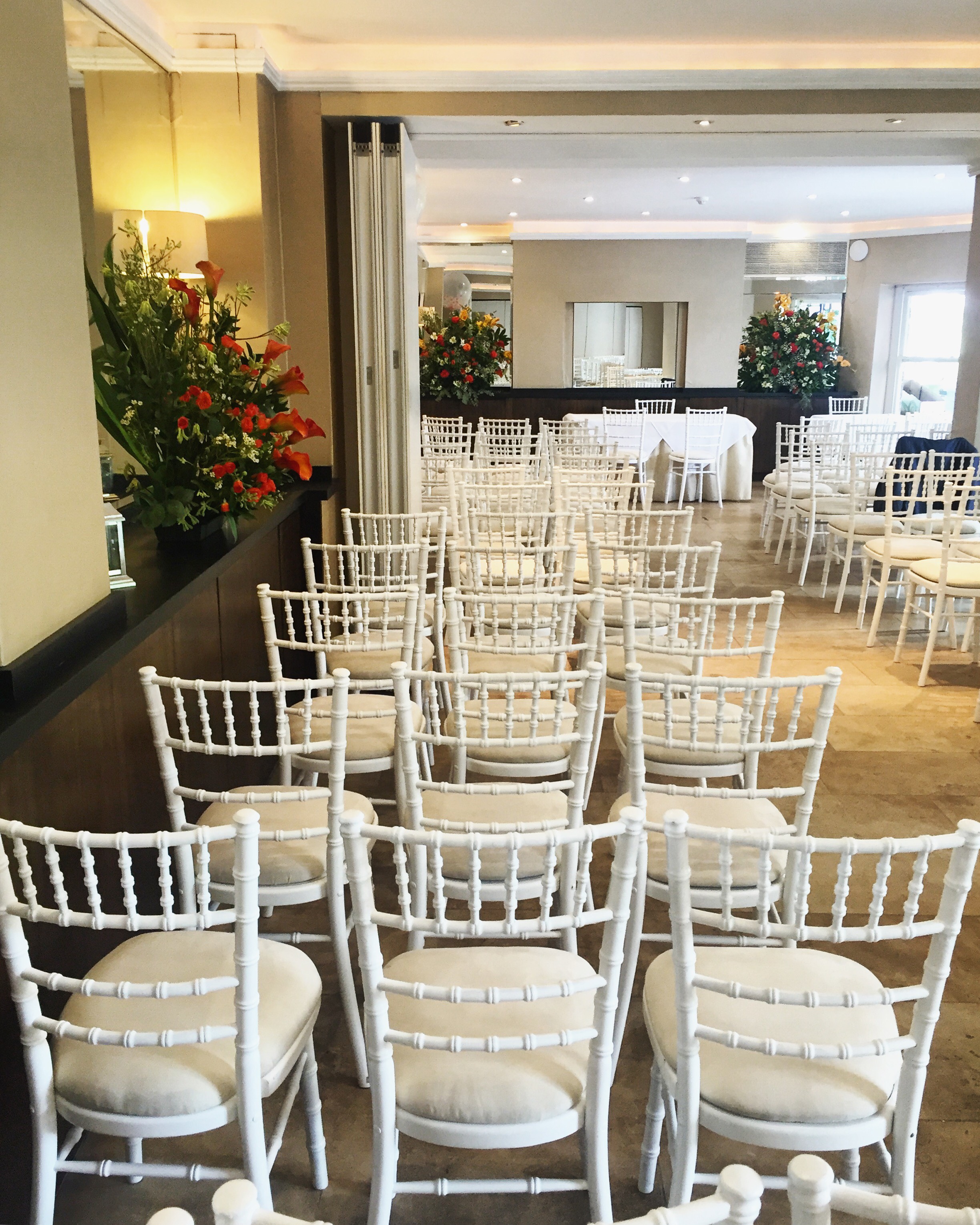 Elegant event space with chiavari chairs, perfect for gatherings and ceremonies.