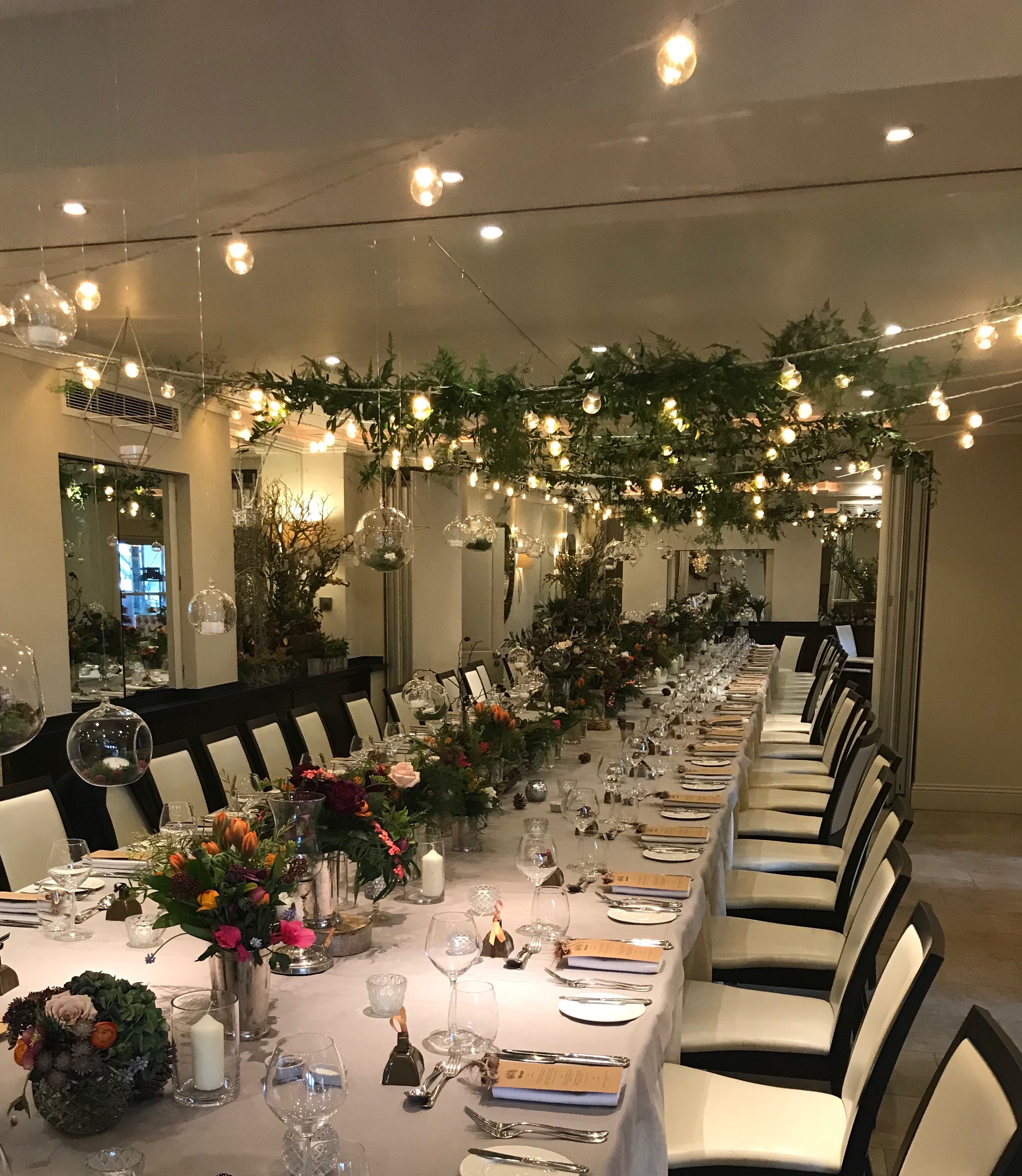 Elegant dining setup with floral centerpieces for weddings and corporate dinners.