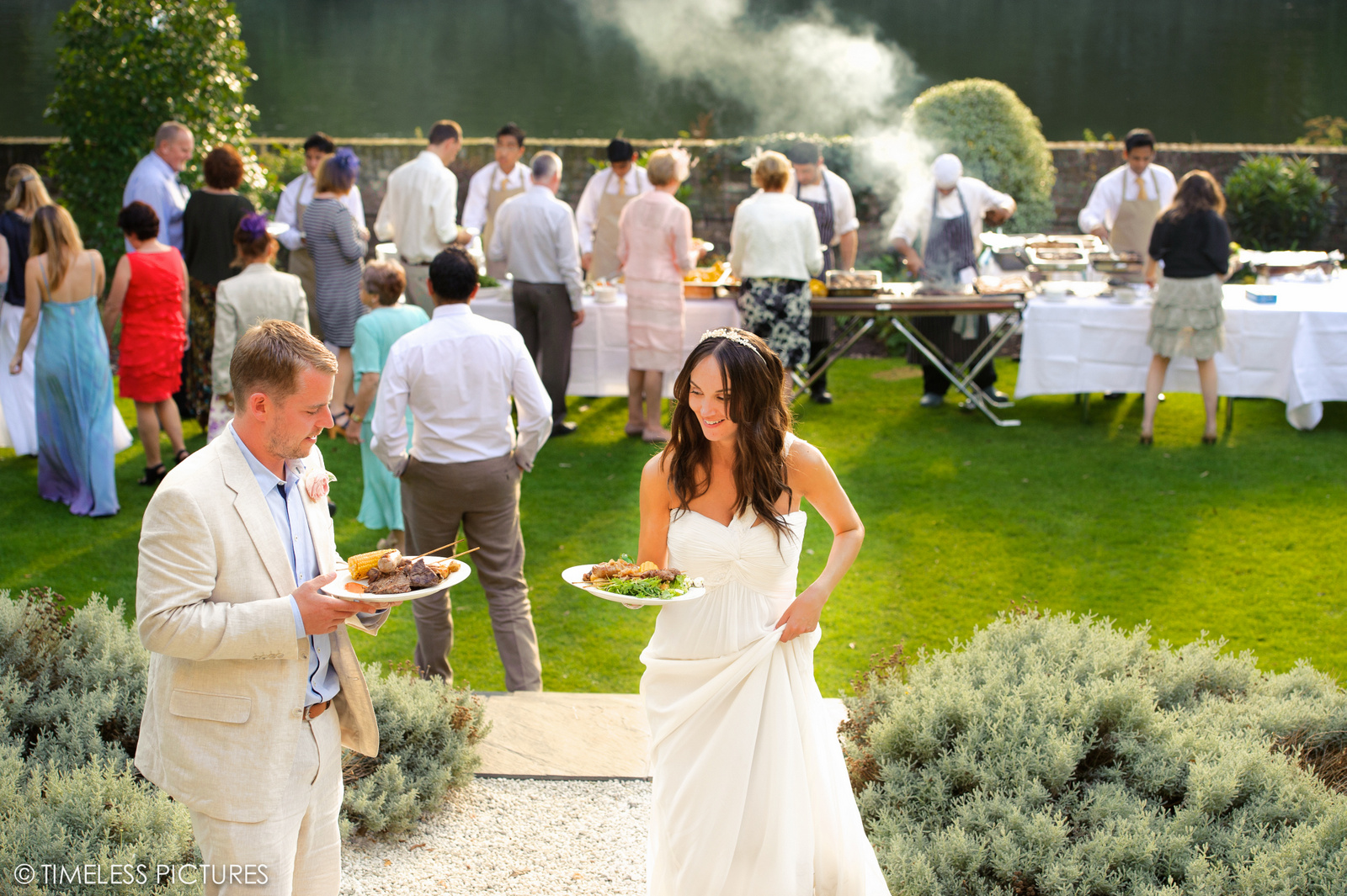 Outdoor wedding reception at The Bingham with lush lawn and buffet catering.