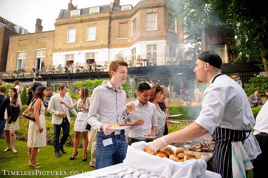 Outdoor barbecue event at The Bingham's Terrace & Garden with lush greenery.