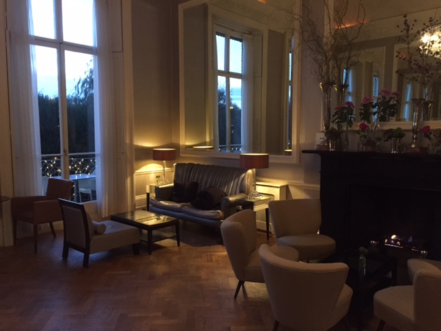 Sophisticated lounge area with warm lighting for networking events at The Bingham.