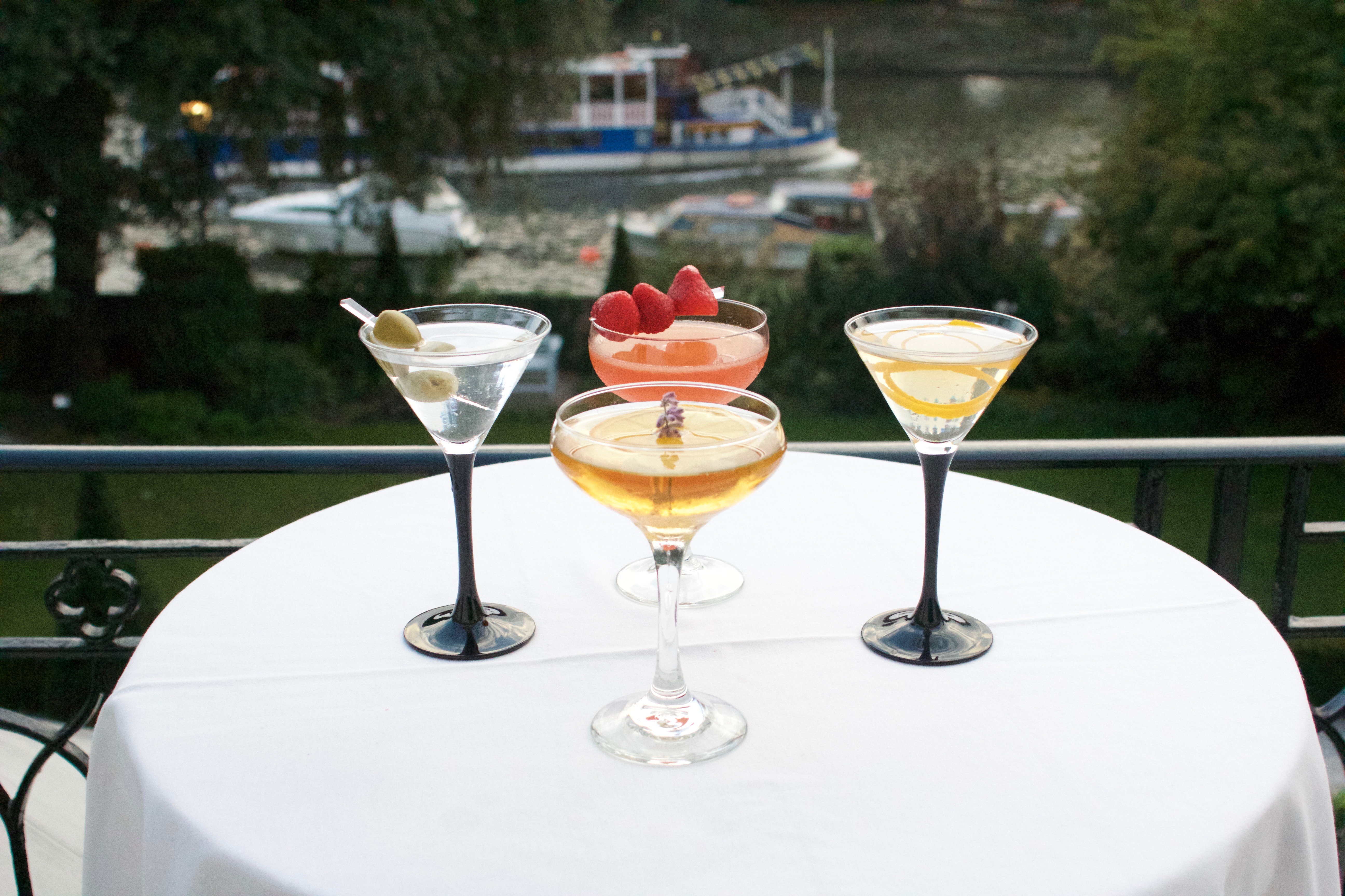 Elegant cocktails at The Bingham's outdoor lounge, perfect for upscale events by the river.