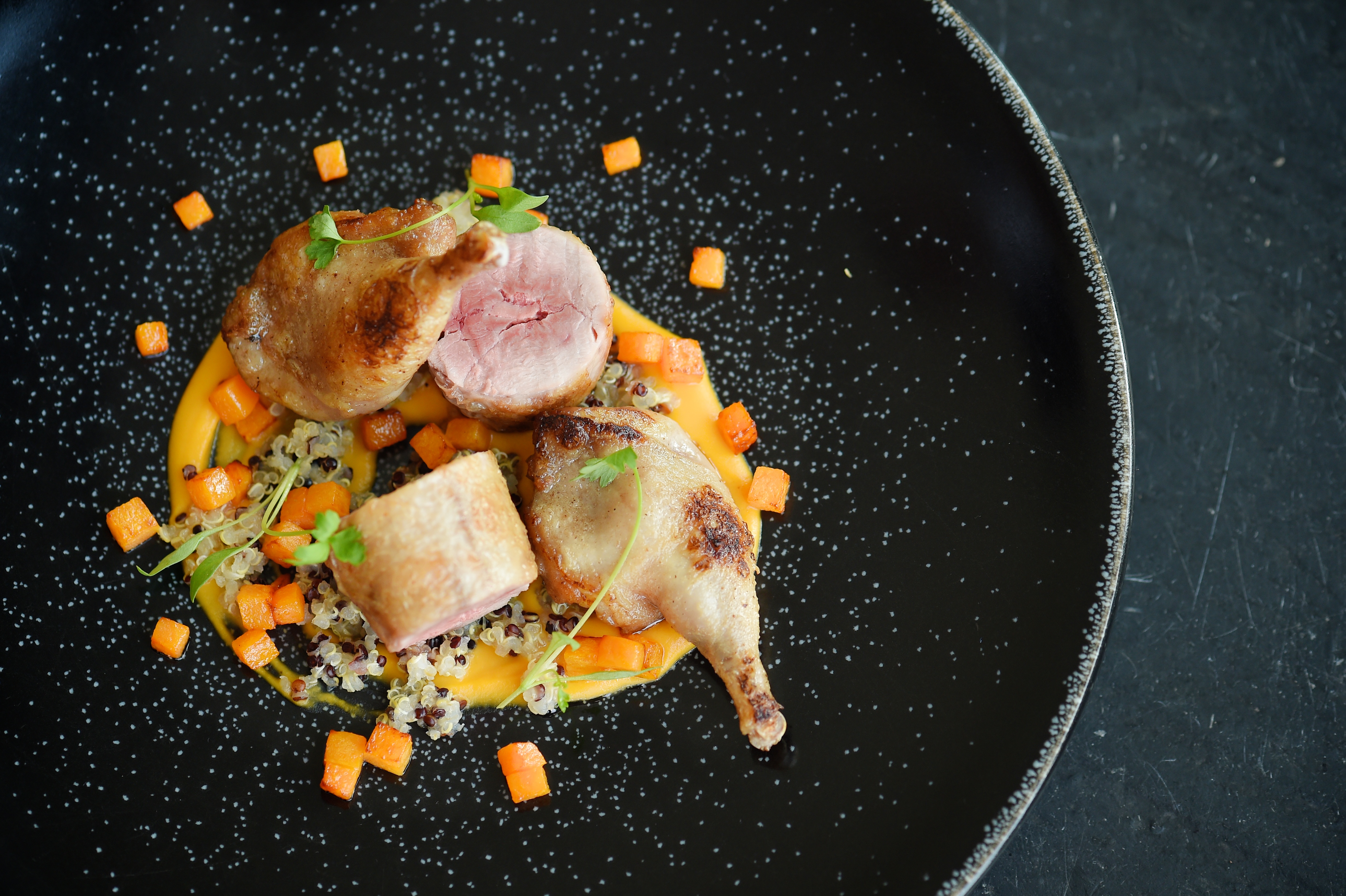 Elegant roasted quail dish at The Bingham for upscale dining events.