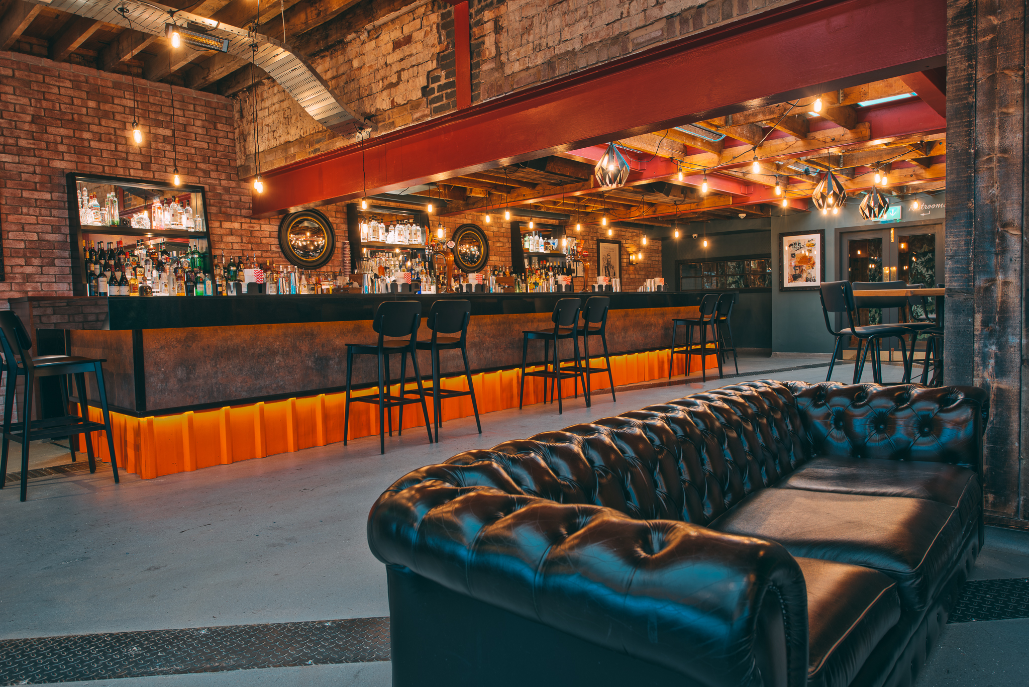 Stylish event space at Upstairs Terrace, Revolution Solihull with modern bar and cozy lounge.